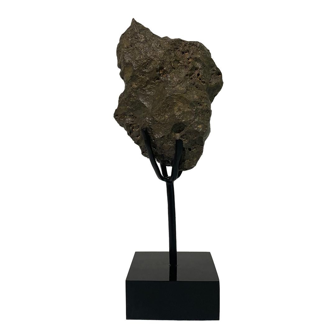 Approximately 4.5 billion years old
North West Africa
Bespoke stand included

The Moon is among the rarest substances on Earth. Every lunar meteorite known to exist would fit into four footlockers. This rare lunar rock is a piece of the Moon