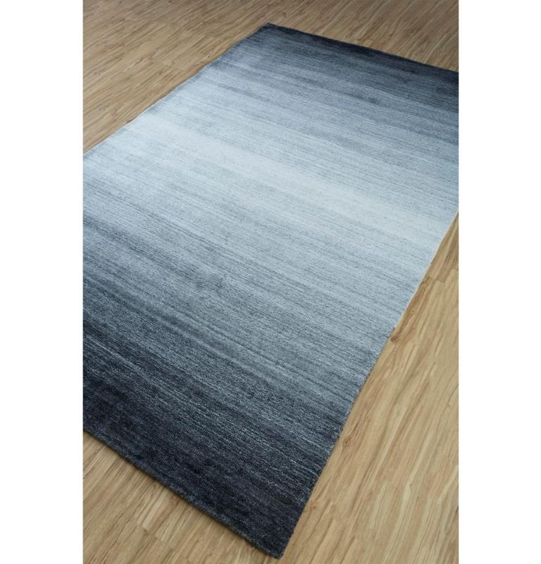 Embrace the celestial elegance with our Modern Handmade Rug, a masterpiece in the tranquil palette of natural taupe. Inspired by the mesmerizing gradient of moonlit skies, this rug seamlessly blends contemporary style with timeless allure. Crafted