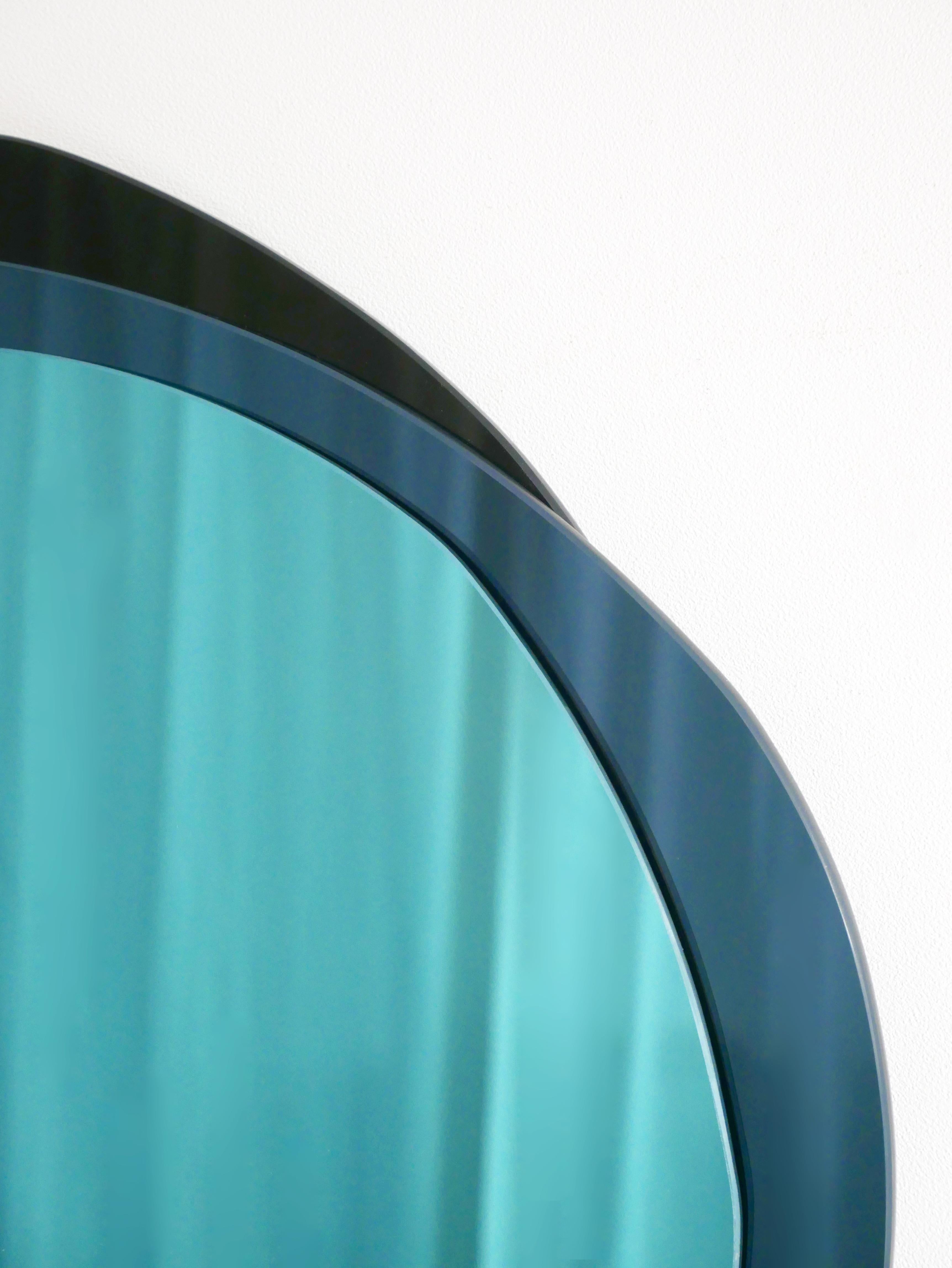 Lunar X-large hand-sculpted mirror, Laurene Guarneri
Limited edition.
Handmade.
Materials: Sky blue colored mirror, dark blue colored mirror, dark colored mirror
Dimensions: 100 x 100 cm

Laurène Guarneri is a designer based in