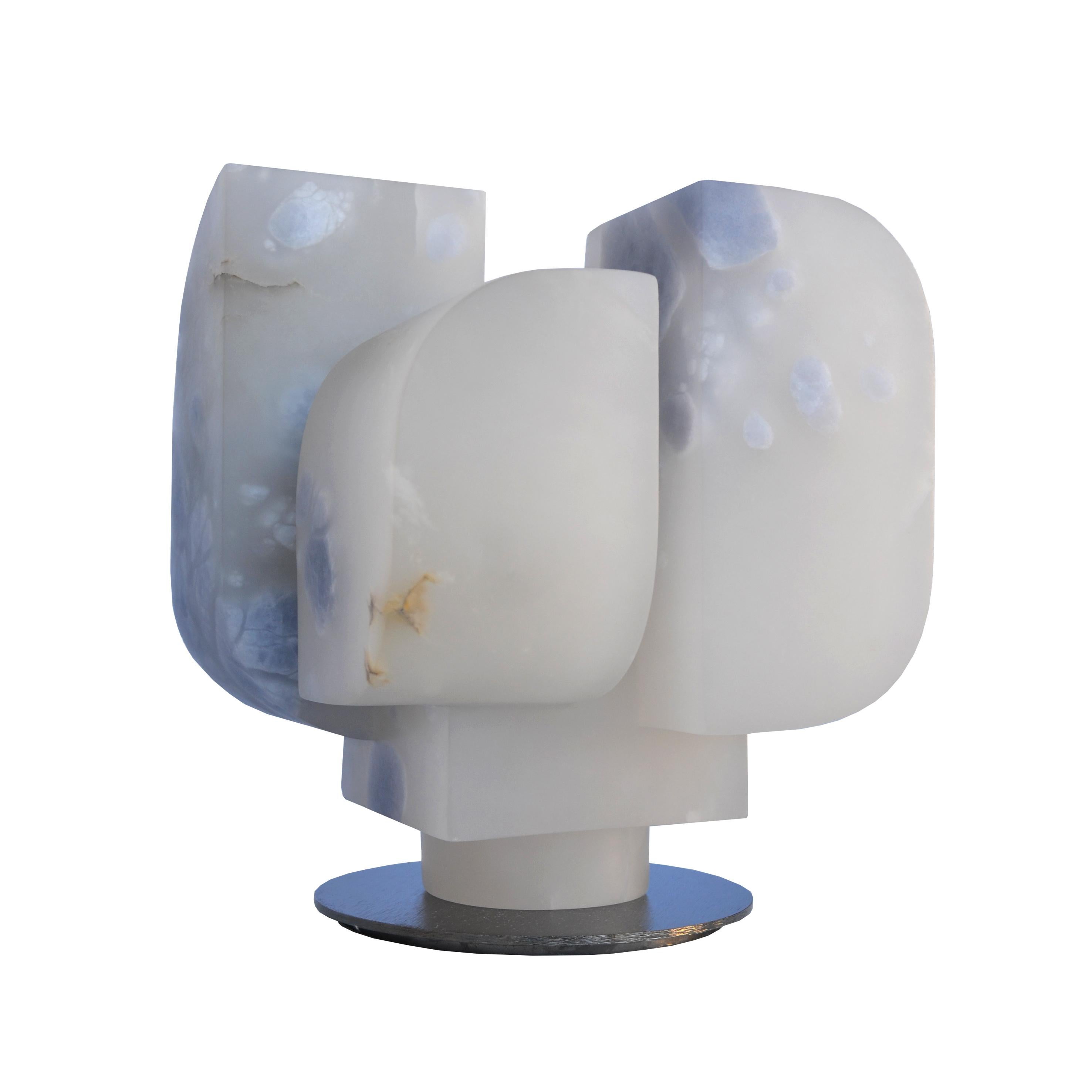 Lunaria Sculpture by Borja Barrajón
Dimensions: D 22 x W 22 x H 25 cm.
Materials: Blue alabaster.

Borja Barrajón Acedo (Madrid, 1985) began his training as a sculptor at the Faculty of Fine Arts in Madrid in 2006. His passion for stone as an
