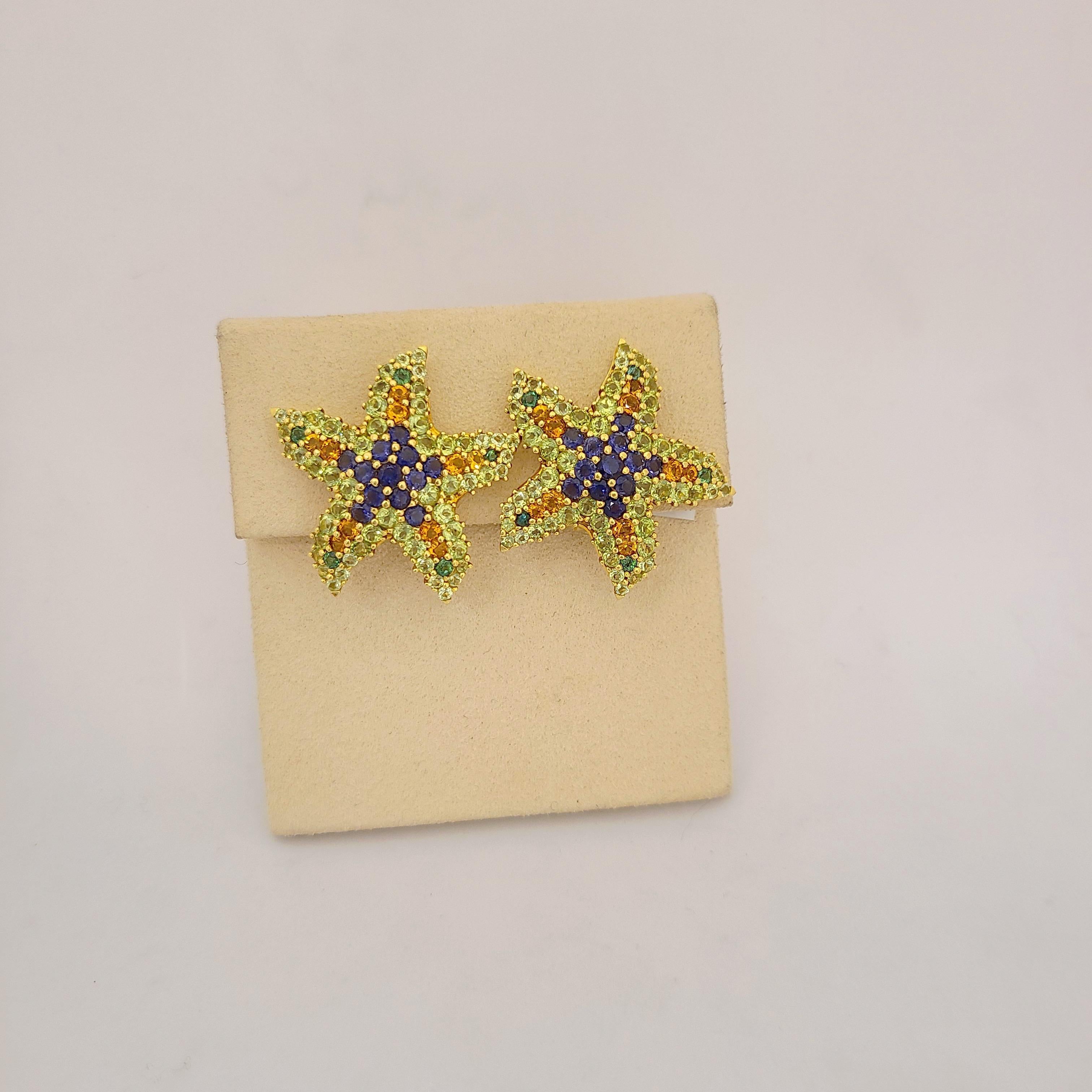 Amazing starfish earrings, set in 18 Karat Yellow Gold. The starfish symbolizes divine love, brilliance, and intuition.
These earrings are set with semi precious round stones of peridot, citrine and iolite - Total Semi Precious weight 3.21Ct.