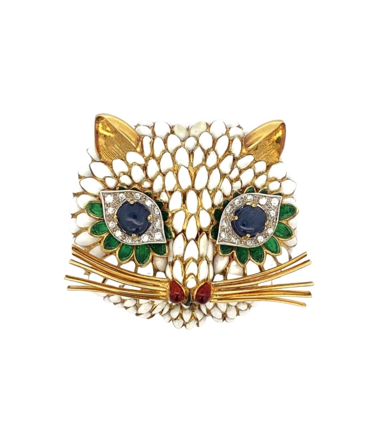 This extraordinary, Italian designer Lunati Gioielli, Cat brooch will captivate with its vintage design and exquisite craftsmanship. Its cabochon sapphire eyes, white, green and red enamel and 18K yellow gold combine to create a truly unique and