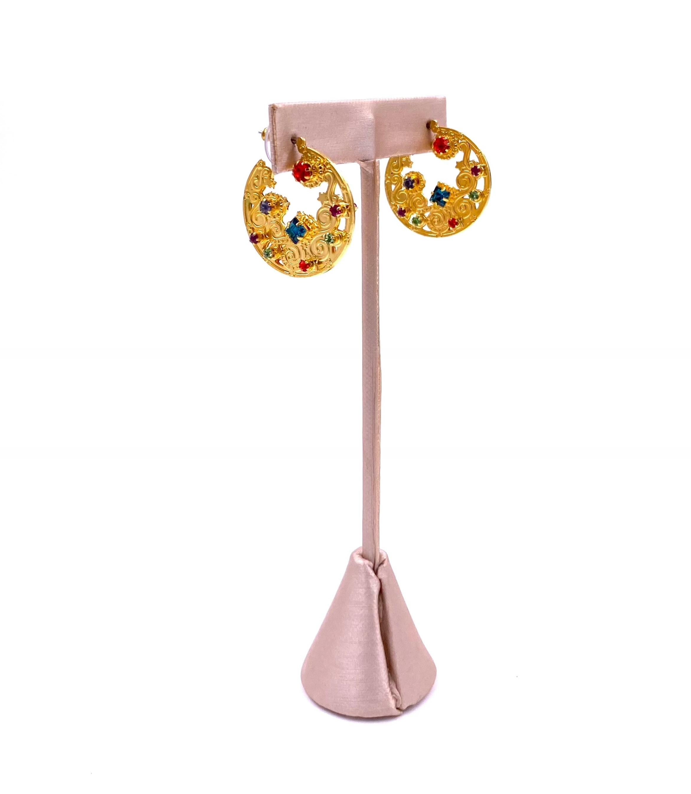 Add some dazzle to your outfits with Lunch at the Ritz Earrings in bright, multi-colored rhinestones. These unique gold moon-shaped earrings are sure to make a statement wherever you go. Shine bright like the moon (but with a little more sparkle)