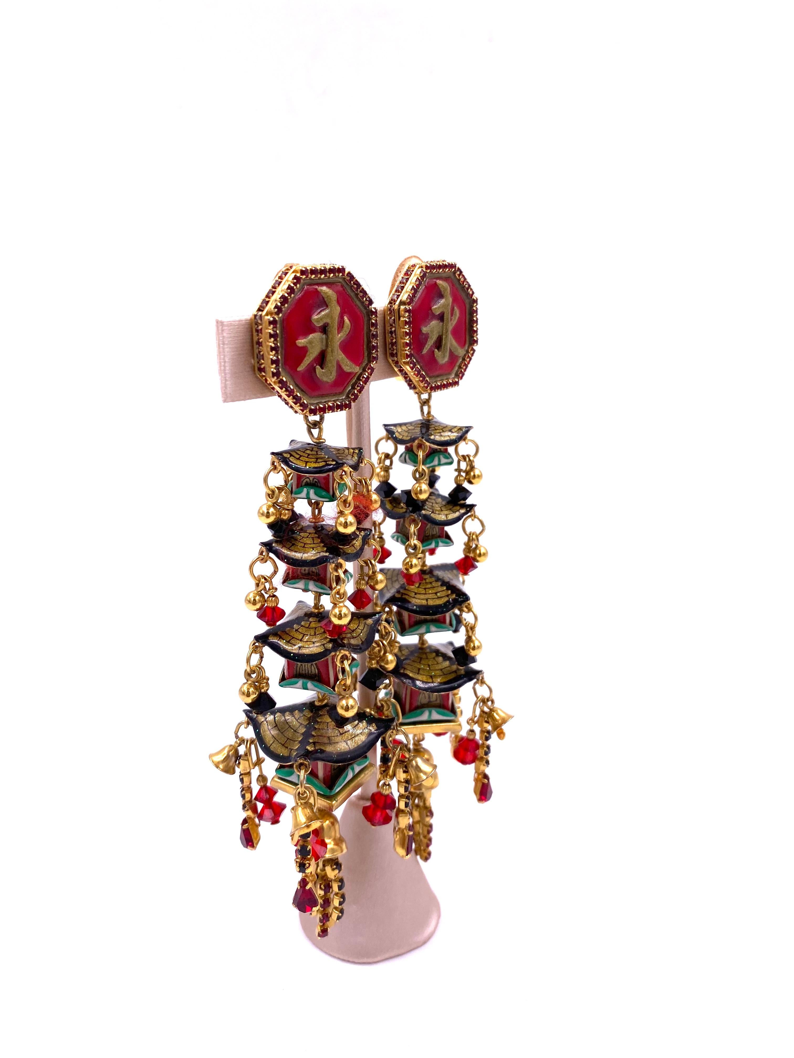Discover the rich heritage behind each intricately designed Chinese Temple Earring from Lunch at The Ritz. Indulge in an extravagant accessory that is both culturally significant and stylish. Immerse yourself in history and elegance with this unique