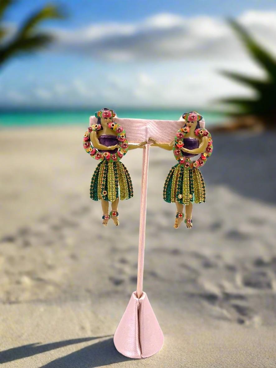 Experience a tropical getaway with the whimsical Lunch at The Ritz Hula Dancer Earrings. These earrings feature a playful hula dancer design, perfect for adding a touch of vacation to any outfit. Let these earrings transport you to a paradise