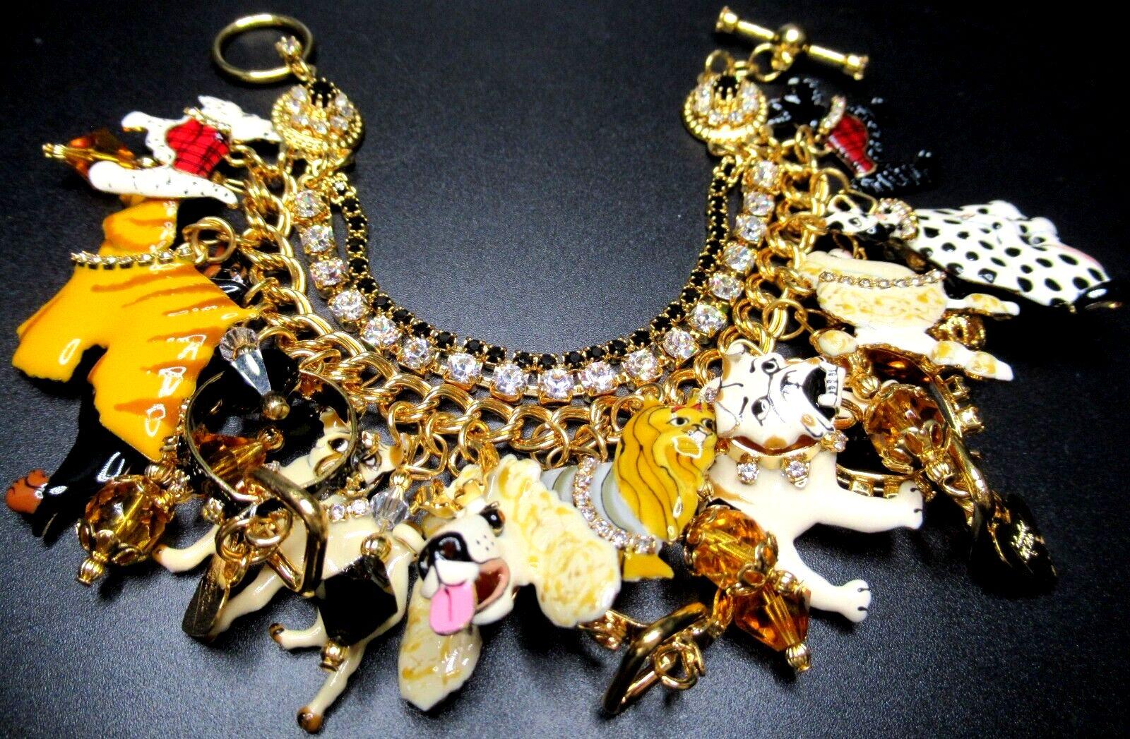 Simply Beautiful! Oscar worthy Iconic LUNCH AT THE RITZ Kennel Club Sparkling Crystal and Enamel Red Carpet Charm Bracelet. Double row Sparkling Crystal Bracelet, suspending numerous a Kennel Club of adorable Dogs. Gold tone mounting. Bracelet