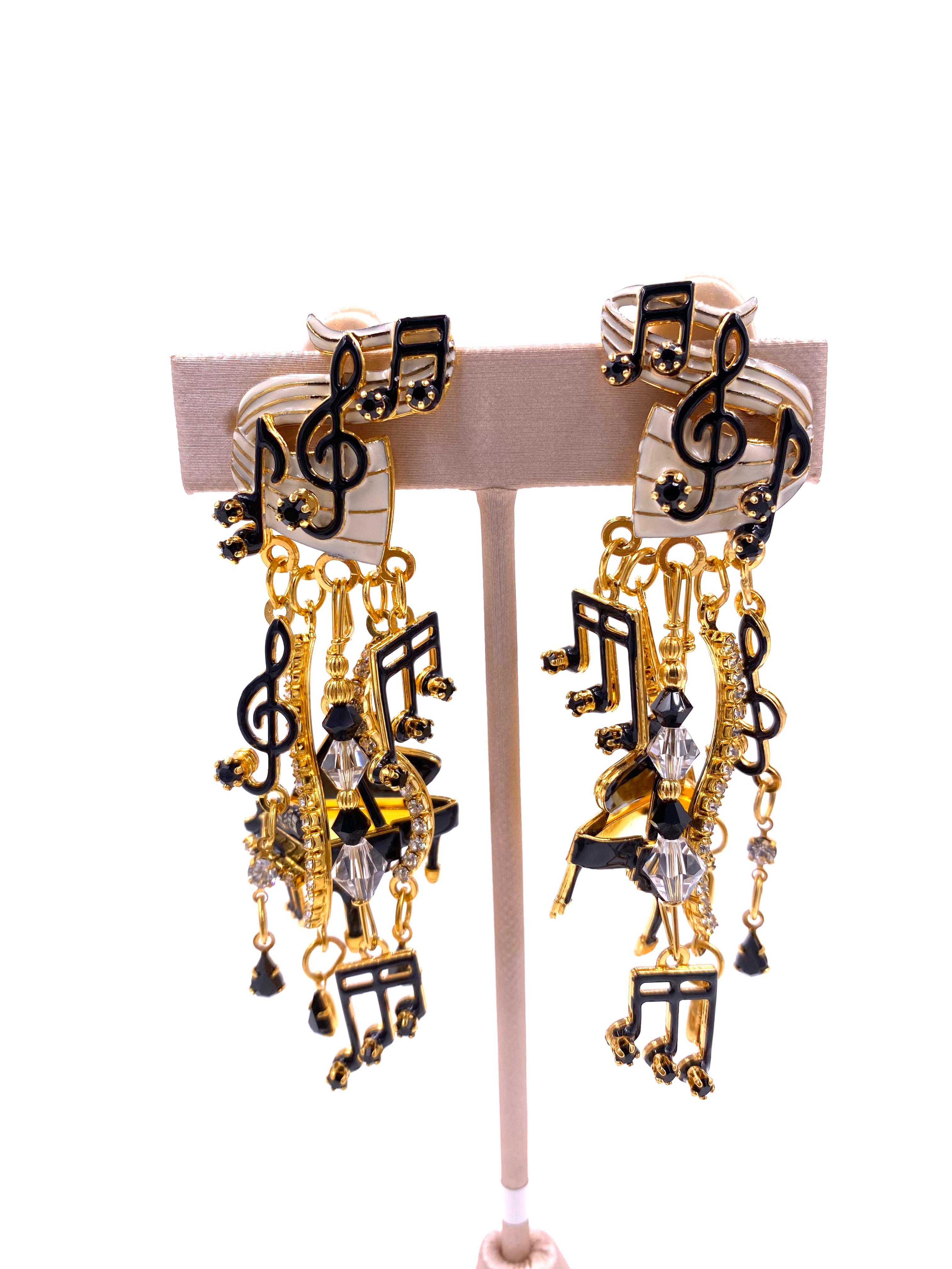 with our Lunch at the Ritz Earrings. These exclusive dangle earrings feature music notes, black rhinestones, and clear beads. Perfect for music lovers and those who appreciate luxurious and tasteful accessories.

Length: 3.5
