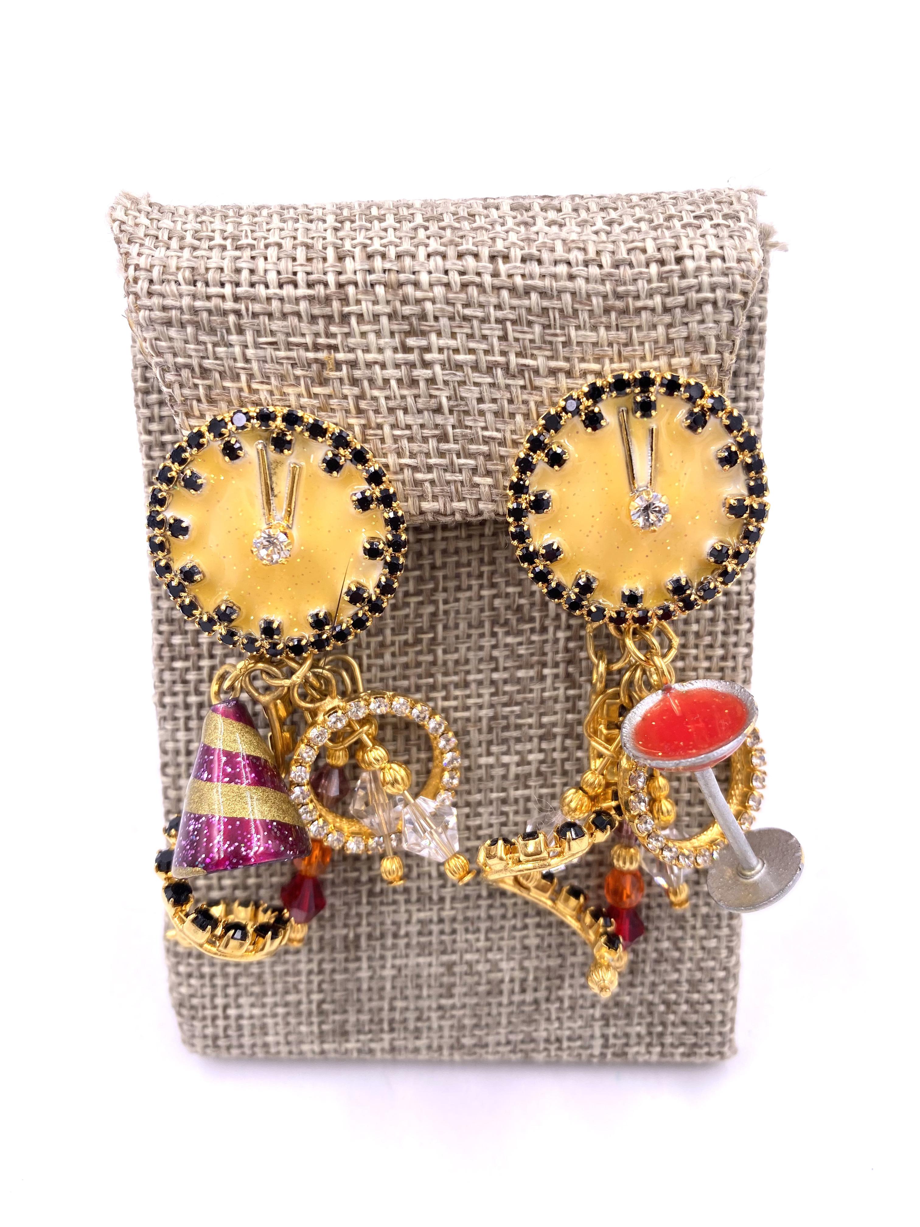 Indulge in luxury with Lunch at the Ritz Earrings - Party Time. These dangle earrings feature whimsical party hat, clock, and martini glass charms for a playful touch. Perfect for adding a touch of glamour and sophistication to any outfit.

Length: