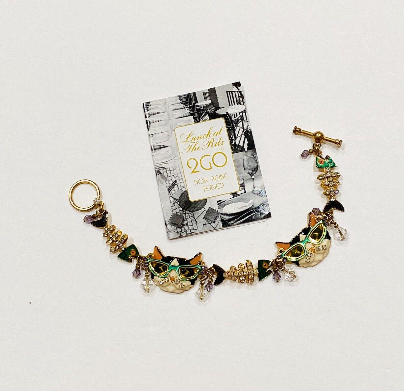 Delightful Vintage Signed Lunch at the Ritz Multi Charm Cats Bracelet. Enamel, Gold plated. Approx. 7.5” Long. Excellent Condition. Chic and Fun to Wear…Sure to be admired...A piece you’ll turn to time and again!  


