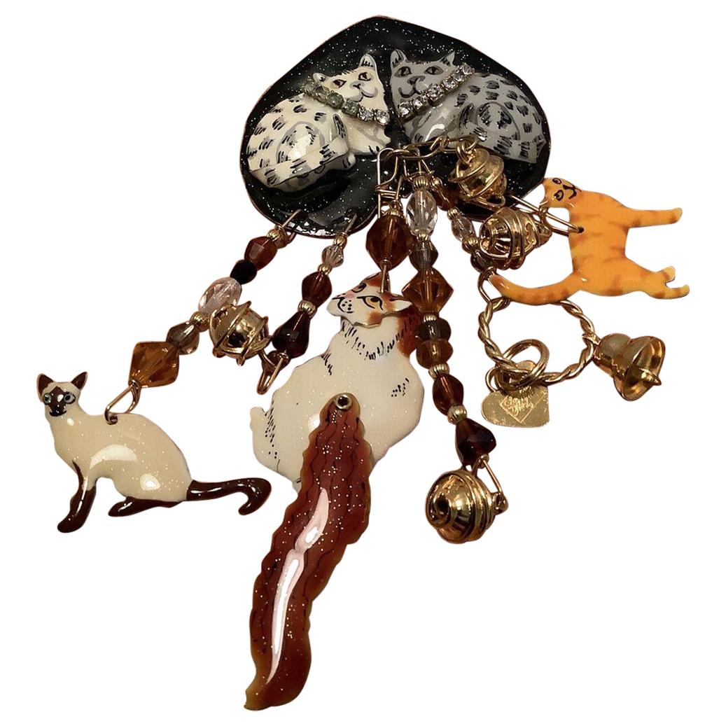 Delightful Vintage Signed Lunch at the Ritz Multi Charm Cats, Enamel and Crystal Gold plated Brooch and Pendant. The largest cat has an articulated head and tail. The two cats laying on an upside down heart have rhinestone collars. Measuring approx.
