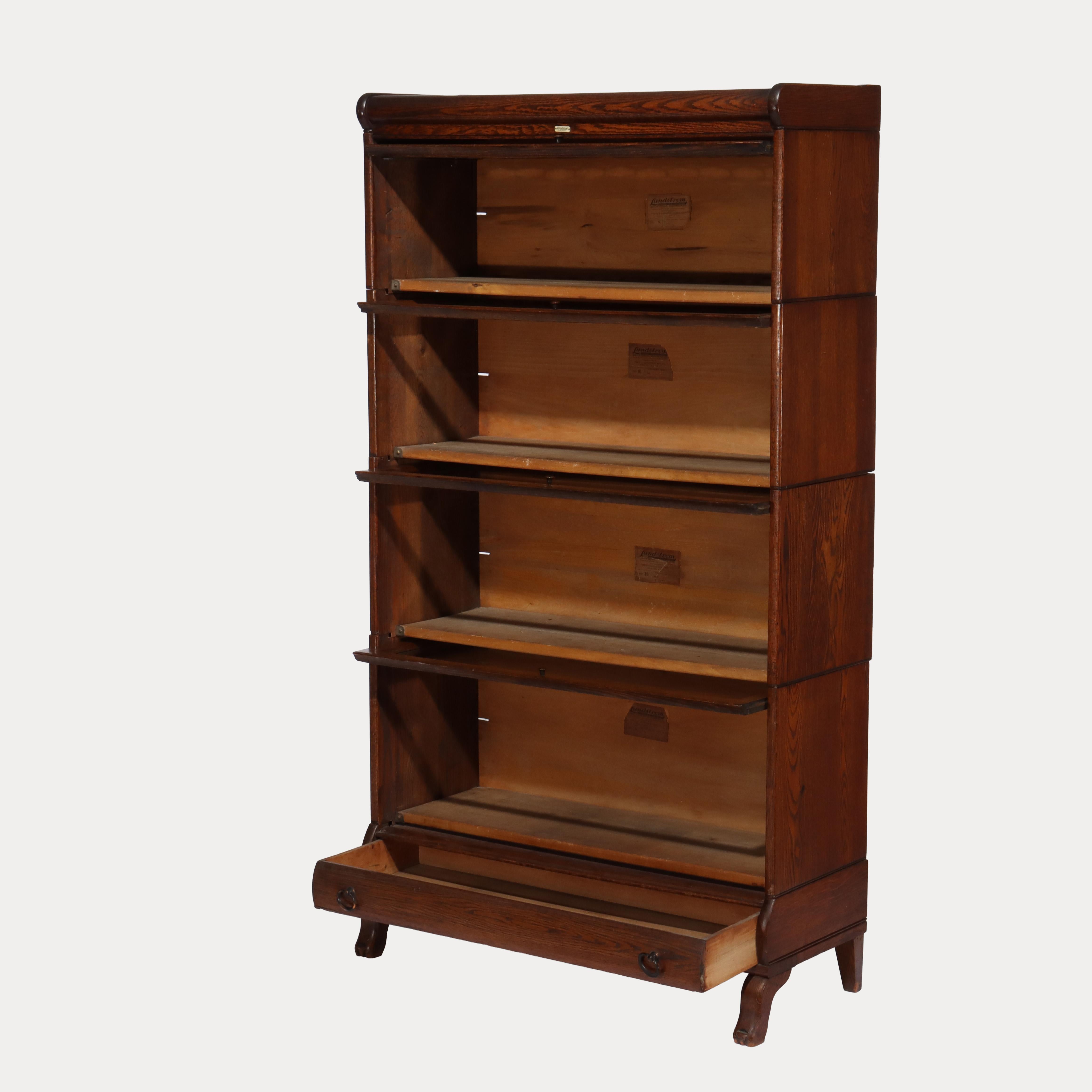 ***Reduced In-House Delivery Rates - Click on “Ask Seller” to Request a Quote***
Antique Lundstrom Arts & Crafts Mission Oak Four Stack Barrister Bookcase with Drawer & Leaded Glass Top Signed C1920.    
Measures - 60.25