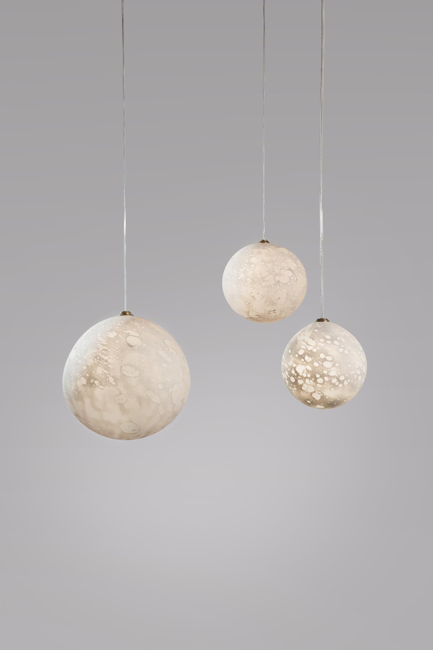 Lunes hanging lights planets, Ludovic Clément d’Armont.
Every creation of Ludovic Clément d’Armont can be made to order in any requested dimensions.
Blown glass.
Dimensions of the planets can vary in the following dimensions: 10 cm, 14 cm, 18 cm,