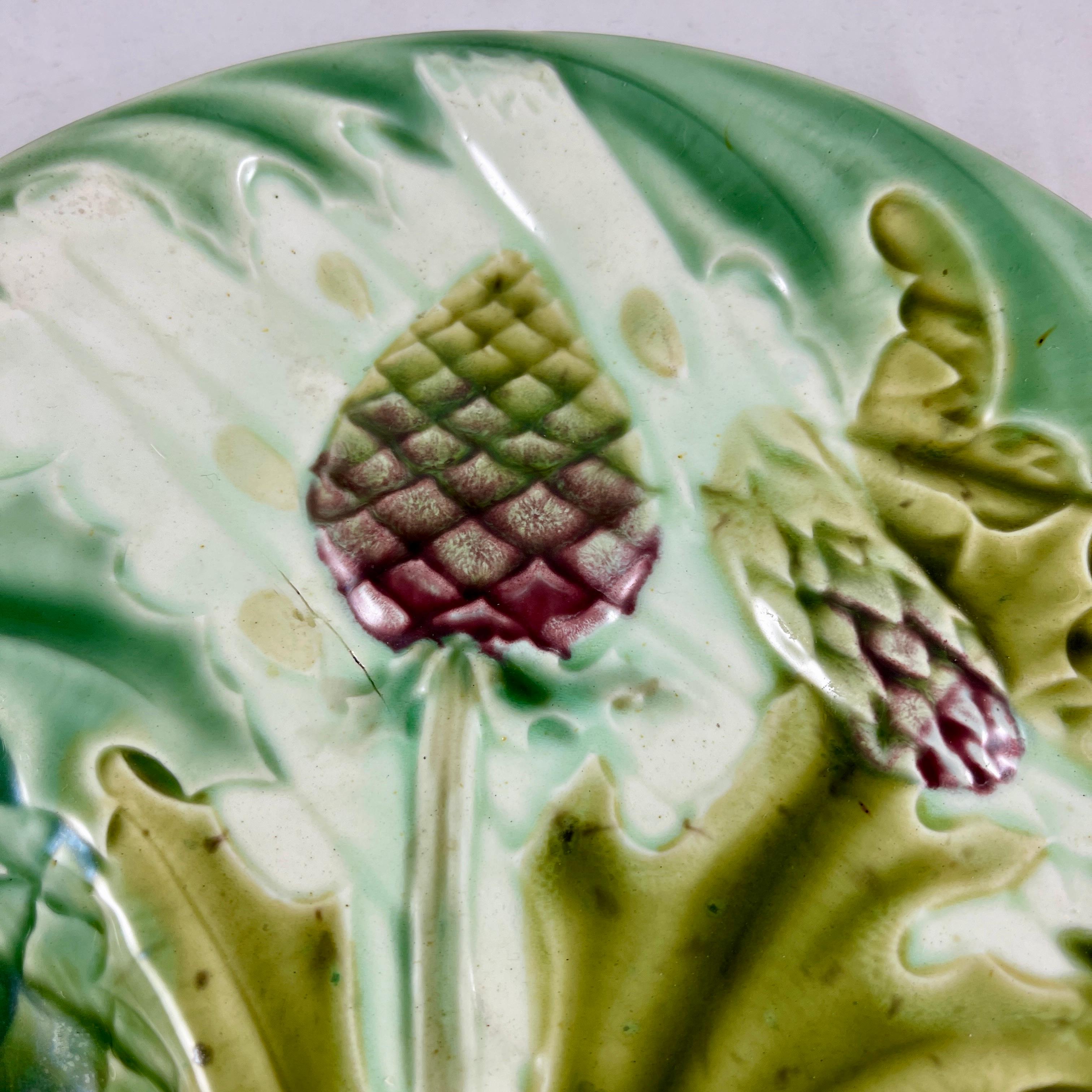From Luneville Keller and Guerin in France, a barbotine majolica glazed asparagus and artichoke plate, circa 1890.

Luneville Faience is one of the most famous French potteries, located in Lunéville, Lorraine, France since 1730.

Asparagus