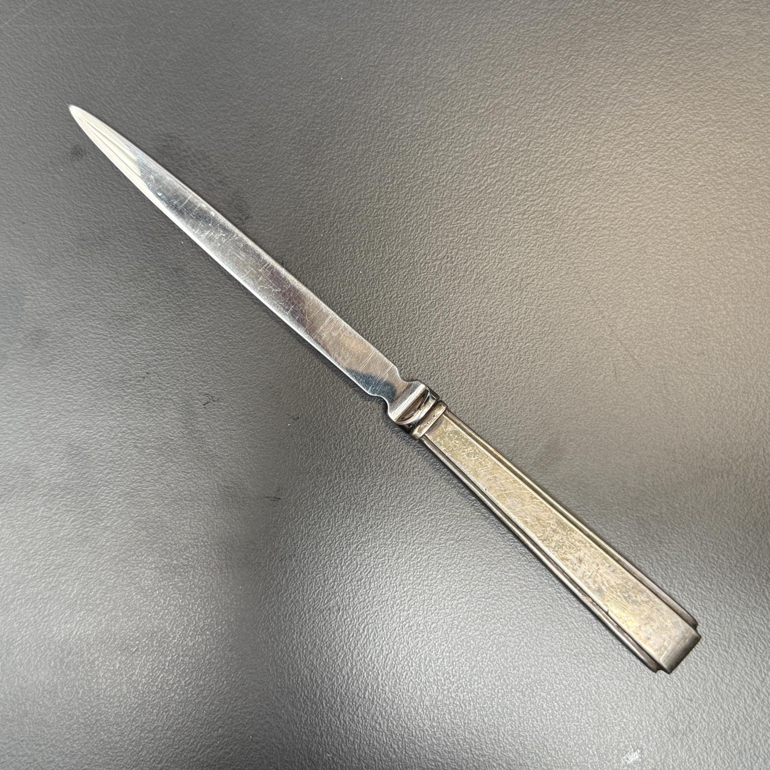 For your consideration, a letter opener by Lunt Silversmith, 925 stamped.
Dimensions: 8 Long x .63 W x .38 Thick

Please visit take a look at our listings, we have an amazing curated collection of hard to find items.

