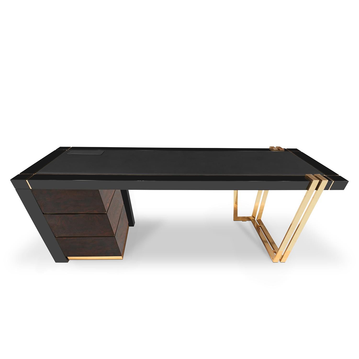 Desk Lupus with structure in solid walnut root
veneer and with solid brass in polished finish. 
With black lacquered top frame. Top is covered 
with black genuine leather with polished brass trim. 
With 3 drawers on easy glide metal runners.