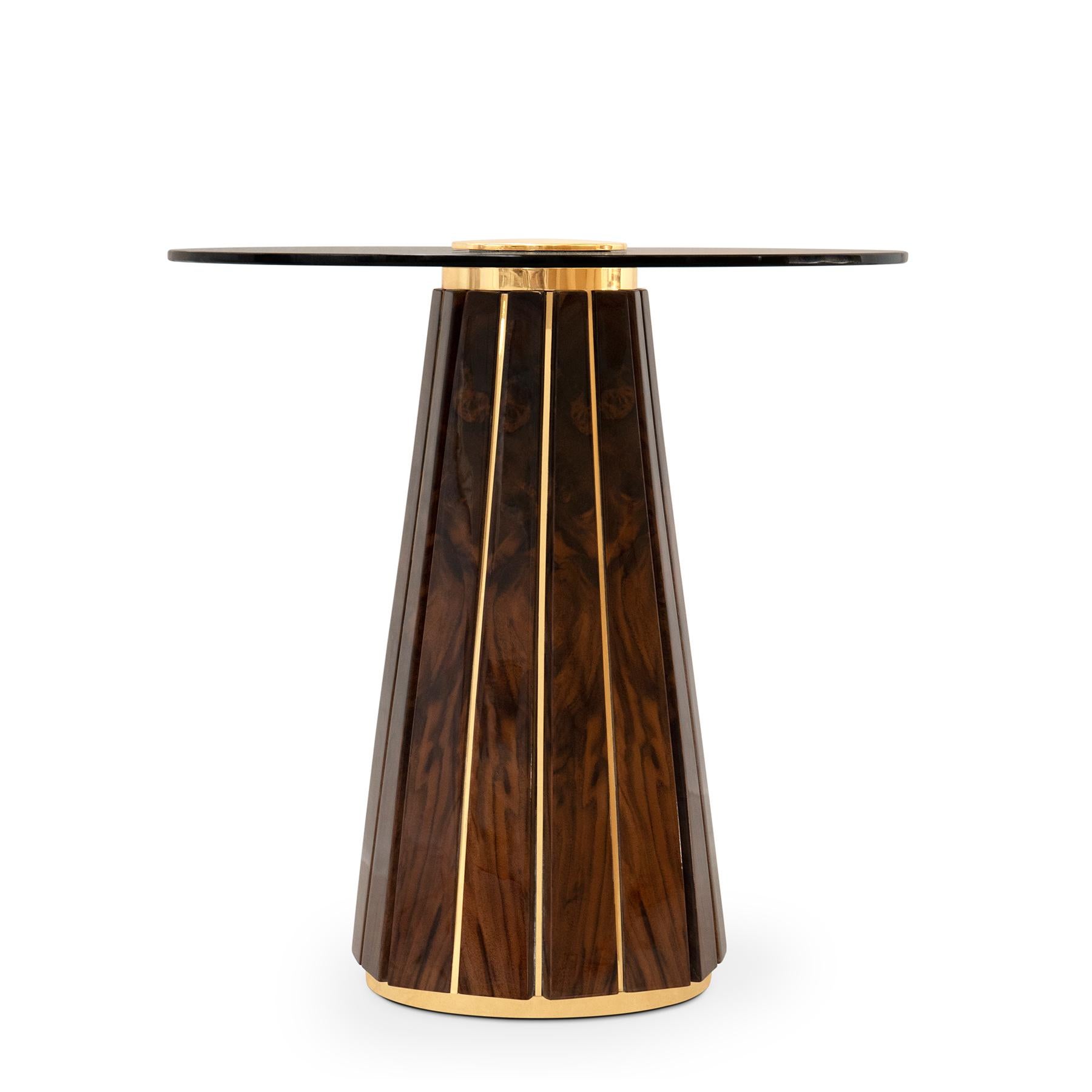 Side table Lupus with structure in solid brass
covered with solid walnut root in varnished finish.
With a blackened glass top with center ring in solid
polished brass.