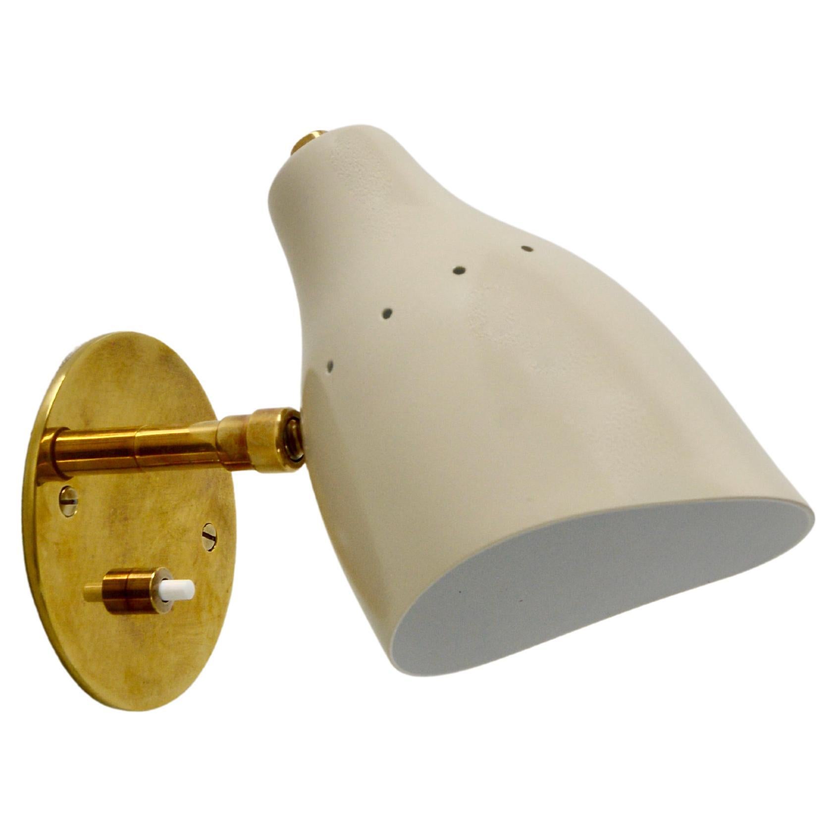 Beautiful Lumfardo LUread spot sconce with a push switch on the backplate. A sconce inspired as a contemporary take on classic midcentury lines. Can be wired for any region worldwide. Single E12 candelabra based socket. Light bulbs supplied.