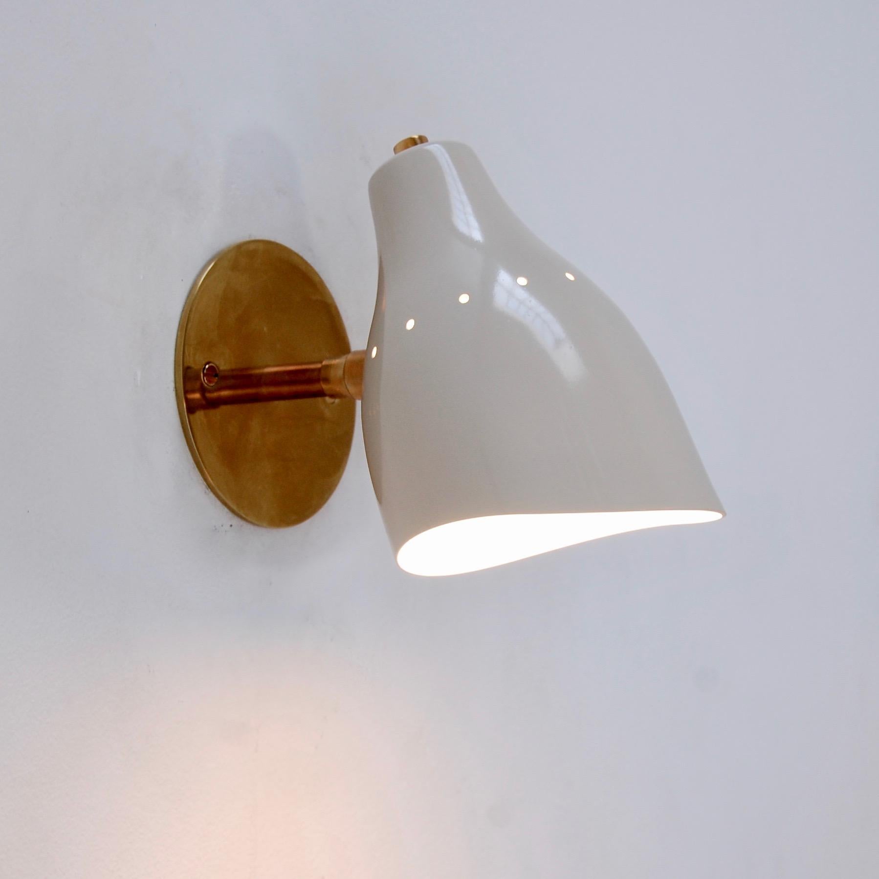 Beautiful Lumfardo LUread spot sconce in a contemporary take on classic midcentury lines. Can be wired for any region worldwide. Single E12 candelabra based socket per sconce. Light bulbs supplied. Priced individually.
Measurements: 
7