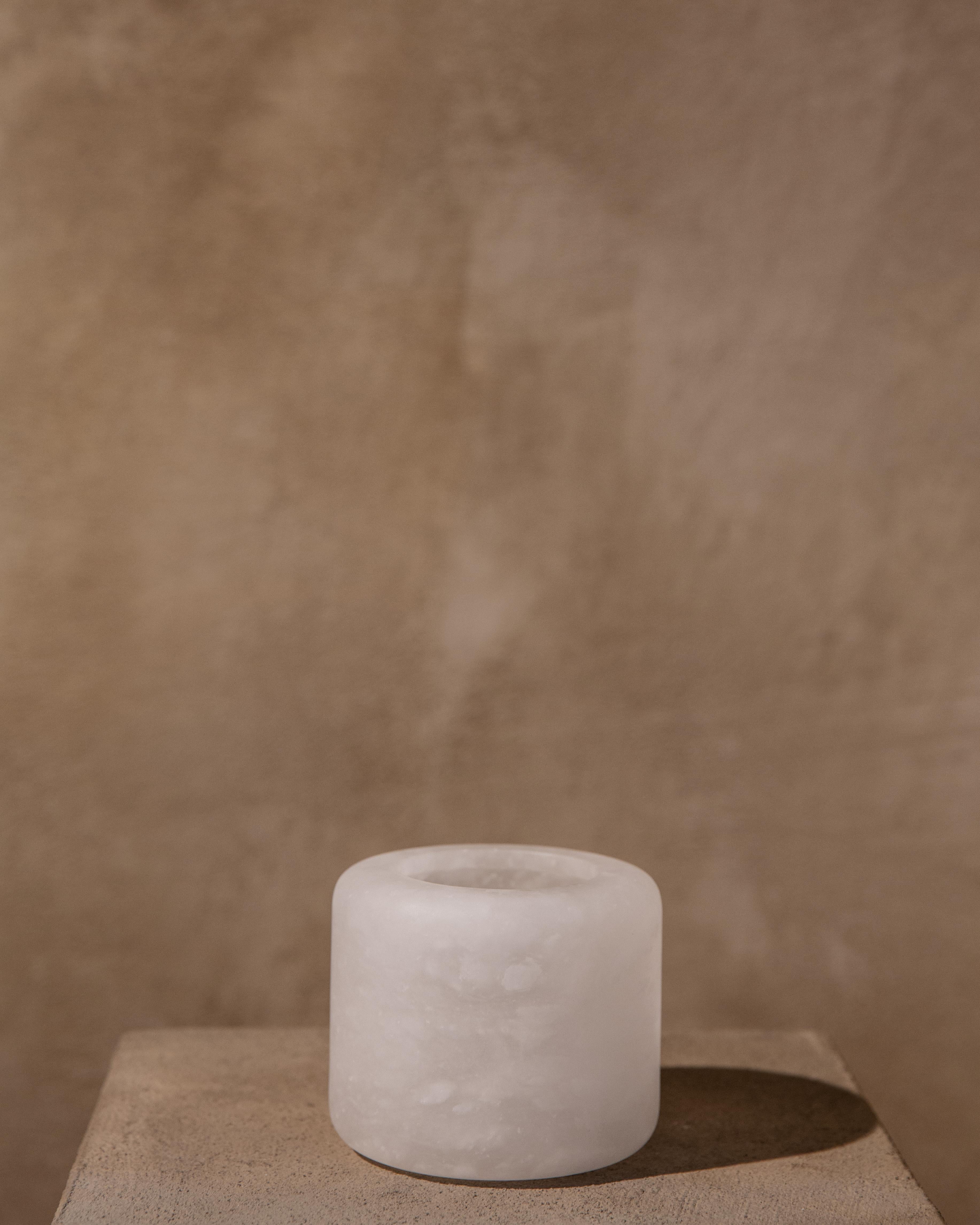 Luri candle holder by Karu
Dimensions: D 10 x H 8 cm
Materials: alabaster.

Contemporary Vessels inspired by Etruscan Antiquity.
Handcrafted in the hills of Tuscany.

Award-winning design firm Karu debuts its latest limited edition home
