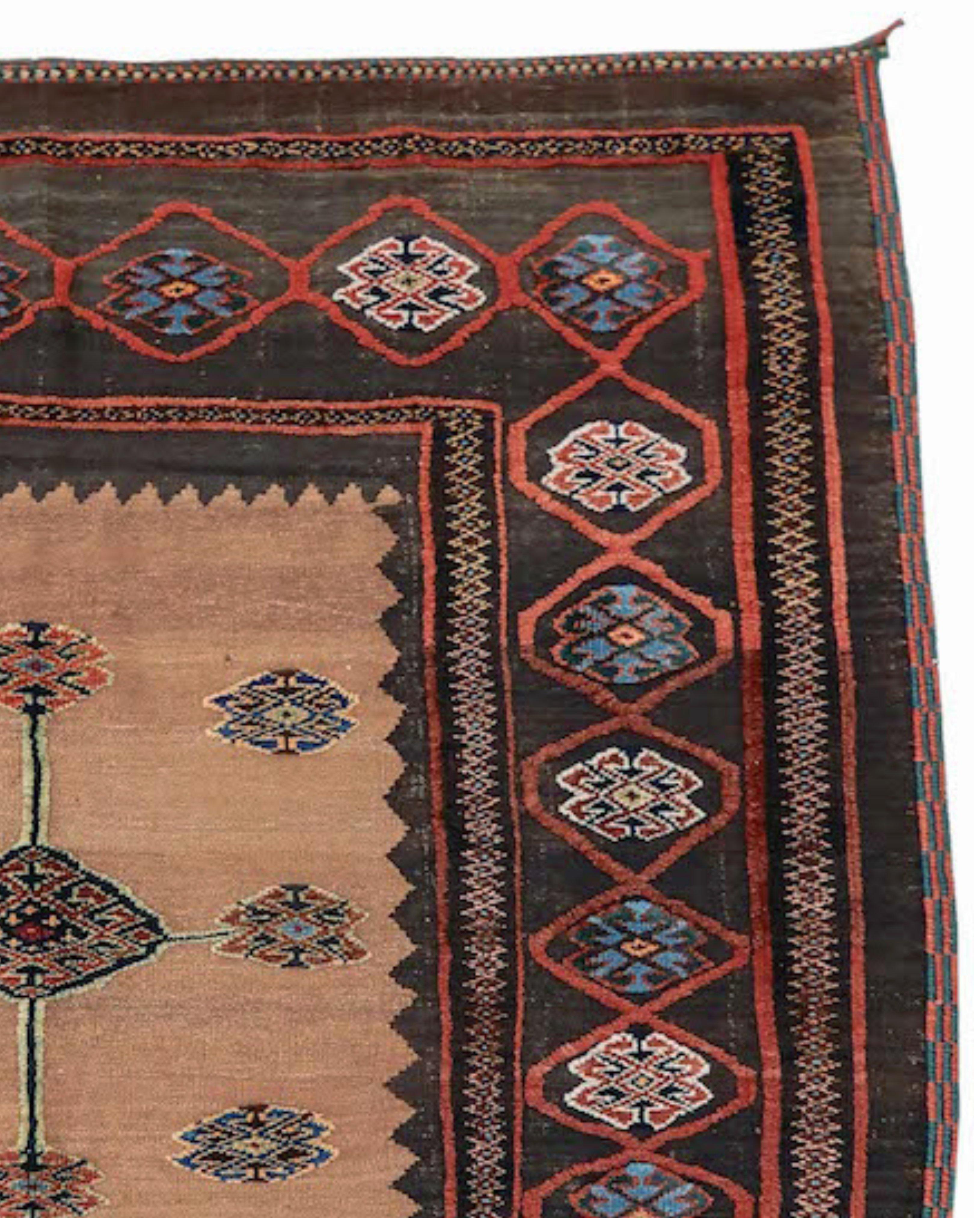 Luri soffreh Rug, Early 20th Century

This dramatic Luri sofreh weaves a highly graphic image with a central cruciform design formed from latch hook diamonds. These motifs are drawn in thick, lustrous pile against a flat woven camel field. A