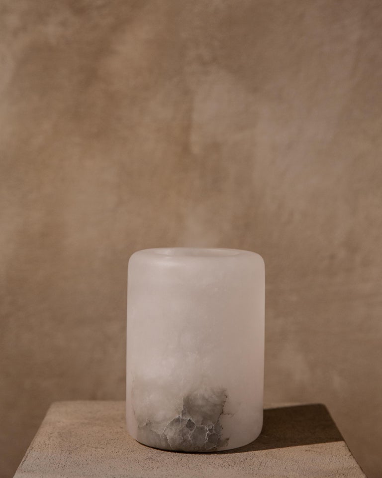 Luri vessel by Karu
Dimensions: D 11 x H 15 cm
Materials: alabaster.

Contemporary Vessels inspired by Etruscan Antiquity.
Handcrafted in the hills of Tuscany.

Award-winning design firm Karu debuts its latest limited edition home accessories