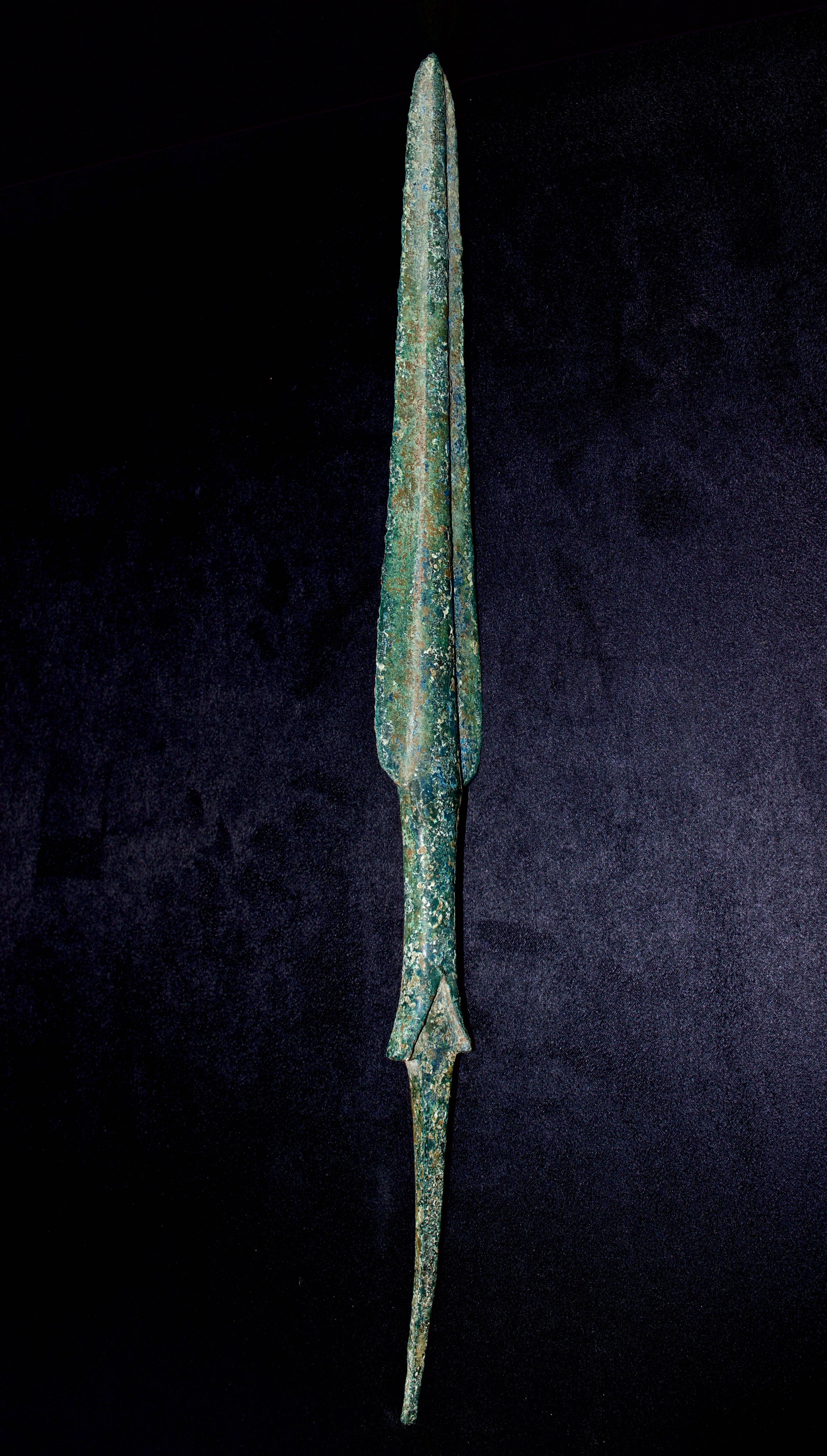A long tapered insertion tang. It features magnificent blue-turquoise green surface patinas, minor edge roughness, otherwise intact. 

Luristan (or Lorestan) is a province of western Iran in the Zagros Mountains. This area was populated by migrant