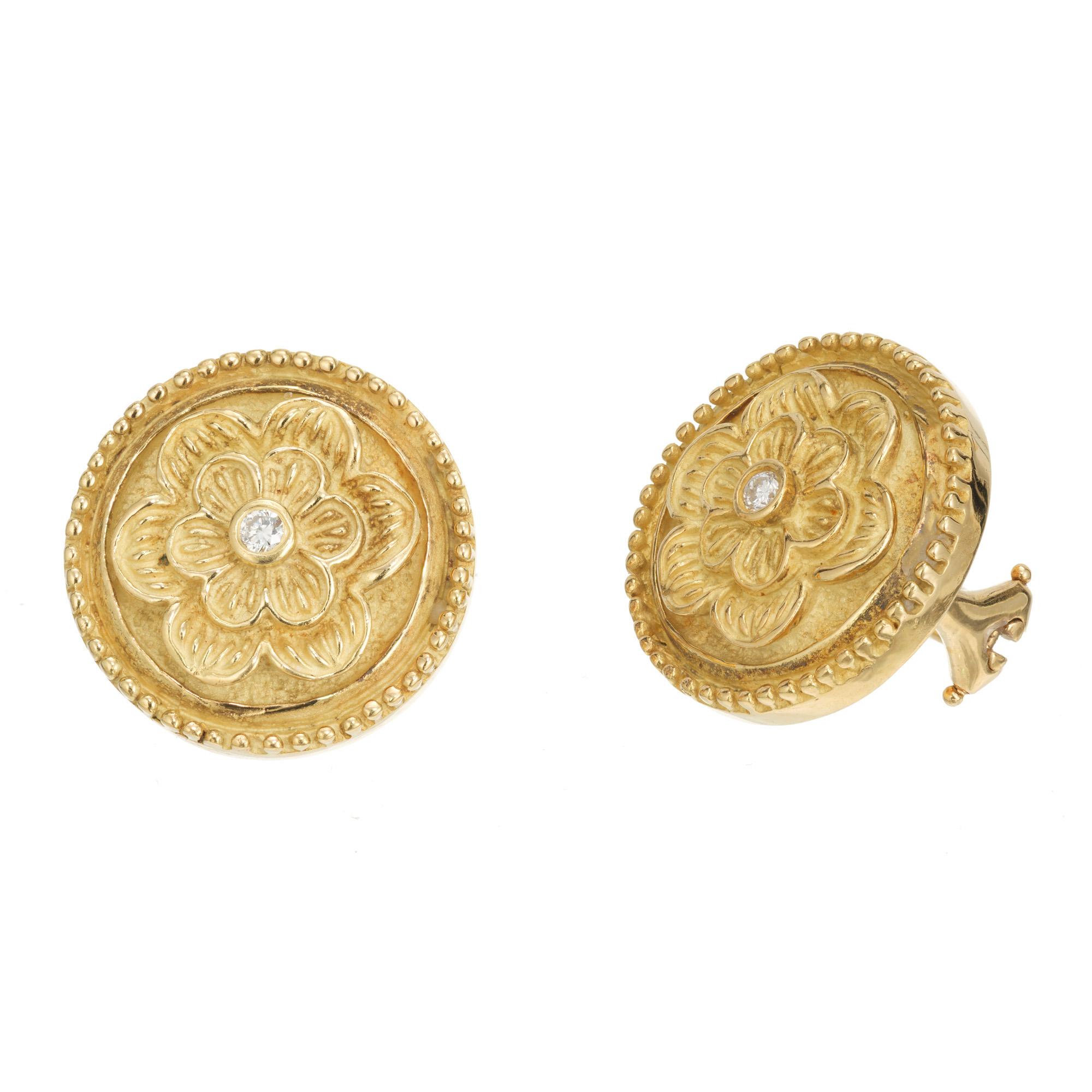 18k green gold button style round flower earrings with textured background. Designer signed. 

2 full cut diamonds, approx. total weight .06cts, F, VS
18k green gold
Stamped: CDII LURO 750
18.2 grams
Diameter: 18mm or .70 inch
Depth: 4.37mm