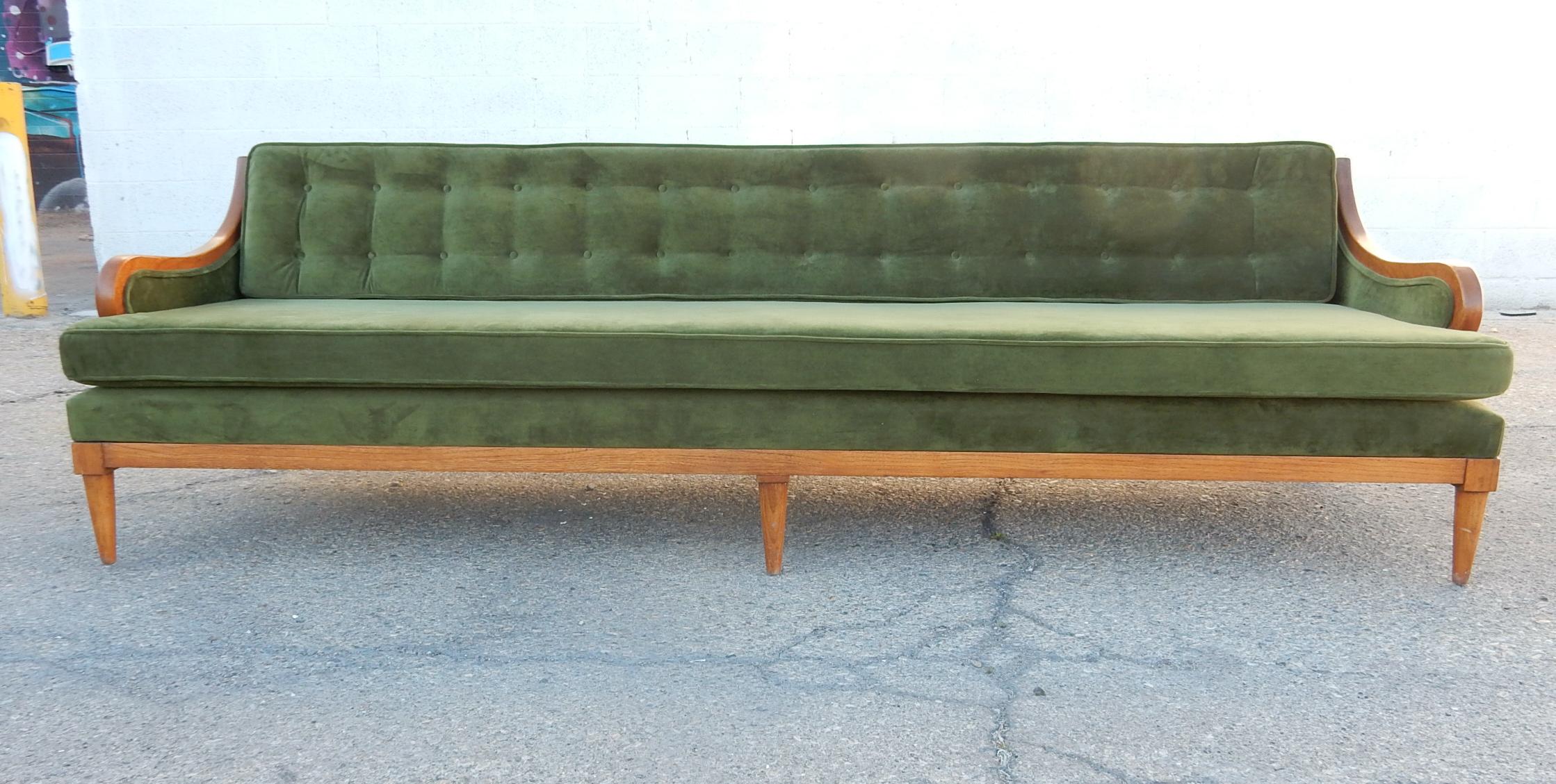 Fabulous green velvet sofa with tufted back cushion and golden wood frame.
Single seat cushion, 8 feet long. Plush and so very comfortable.
Solid high quality piece, designer unknown.