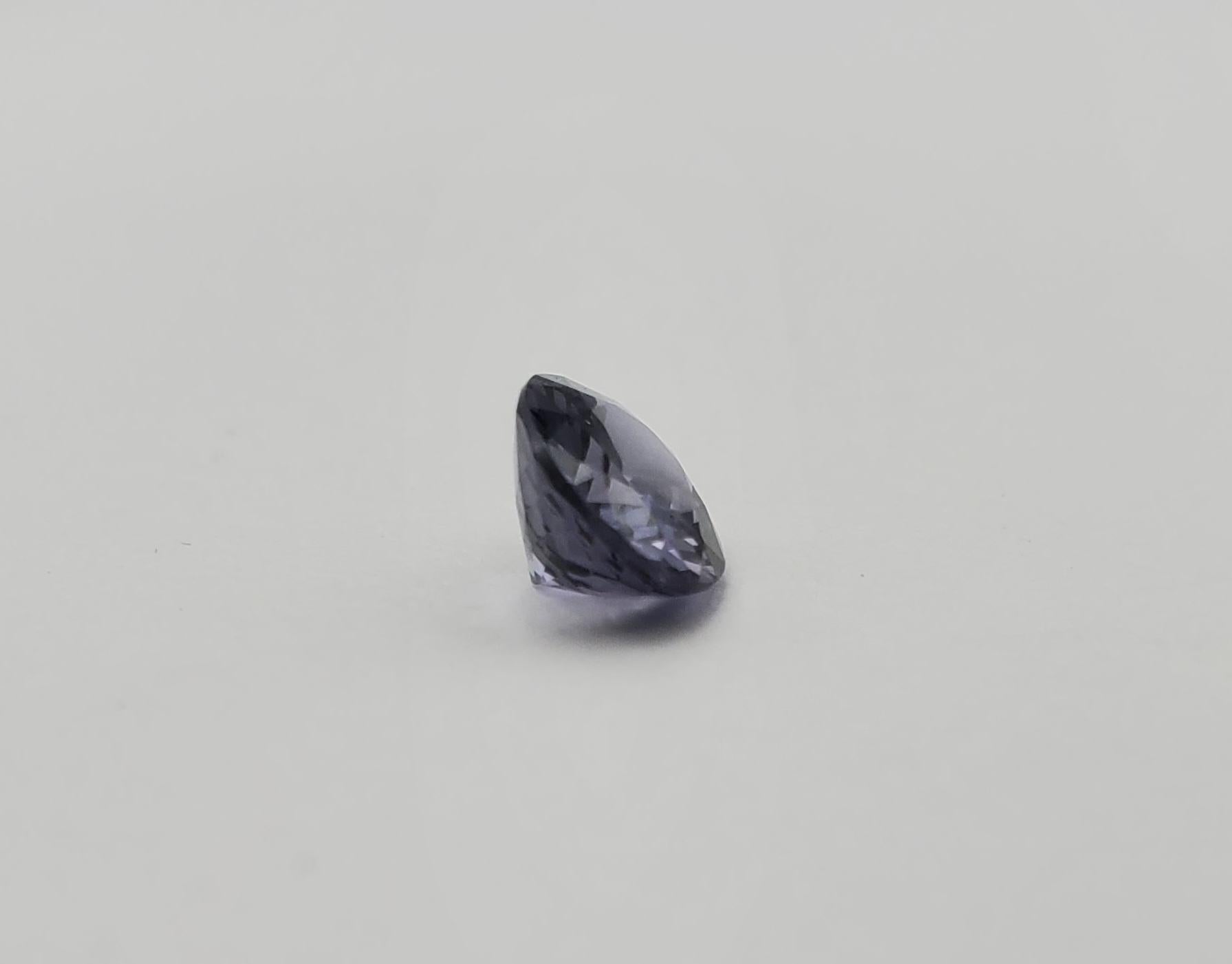 Experience our beautiful and rare 1.71 carat natural oval-shaped platinum spinel. This gemstone is a reflection of nature's sublime artistry with its flashing purple-blue and gray hues. With its impressive precision-cut dimensions of 8.50 x 6.79 x