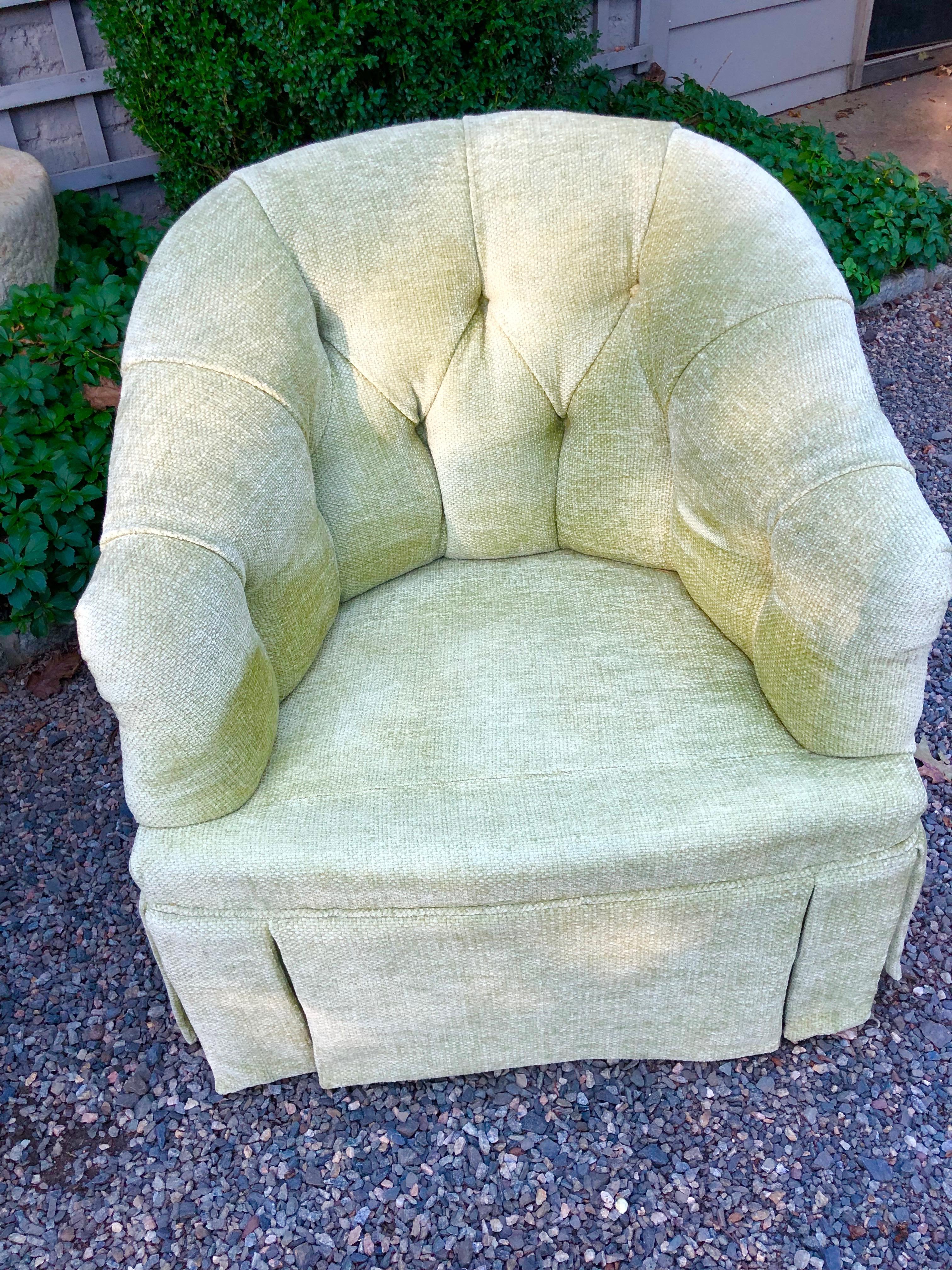 Elegant pair of vintage club chairs attributed to Baker. Newly upholstered in a wonderful shade of pale green chenille. Tailored box pleat and tufted back. Measures: Seat interior depth is 21.5.