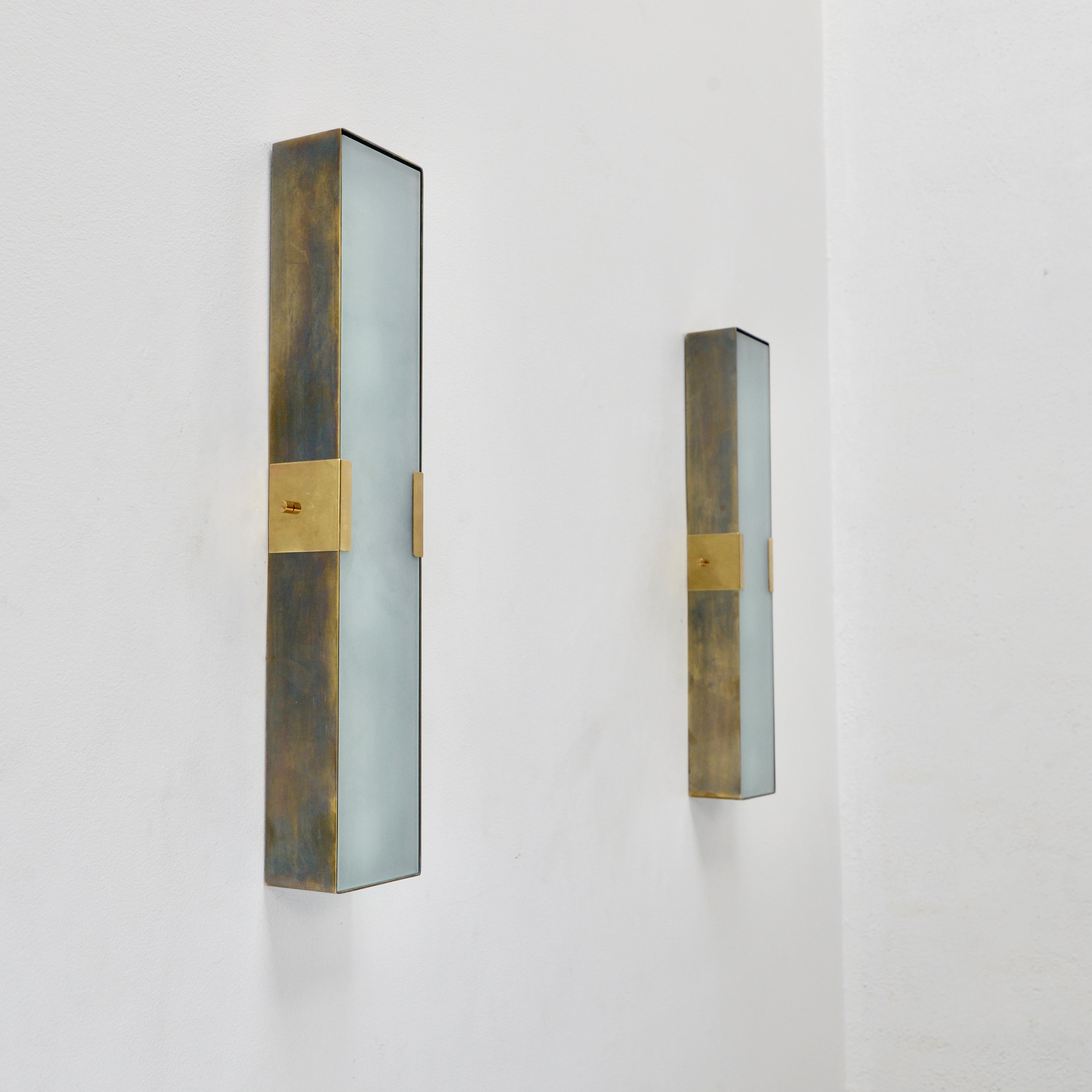 Part of Lumfardo Luminaries contemporary collection, the LUsquare RT Sconce PB is a narrower and longer expression of our LUsquare Sconce. Classic Mid-Century Modern design made to order. Crafted from patinated steel, patinated brass and glass, this