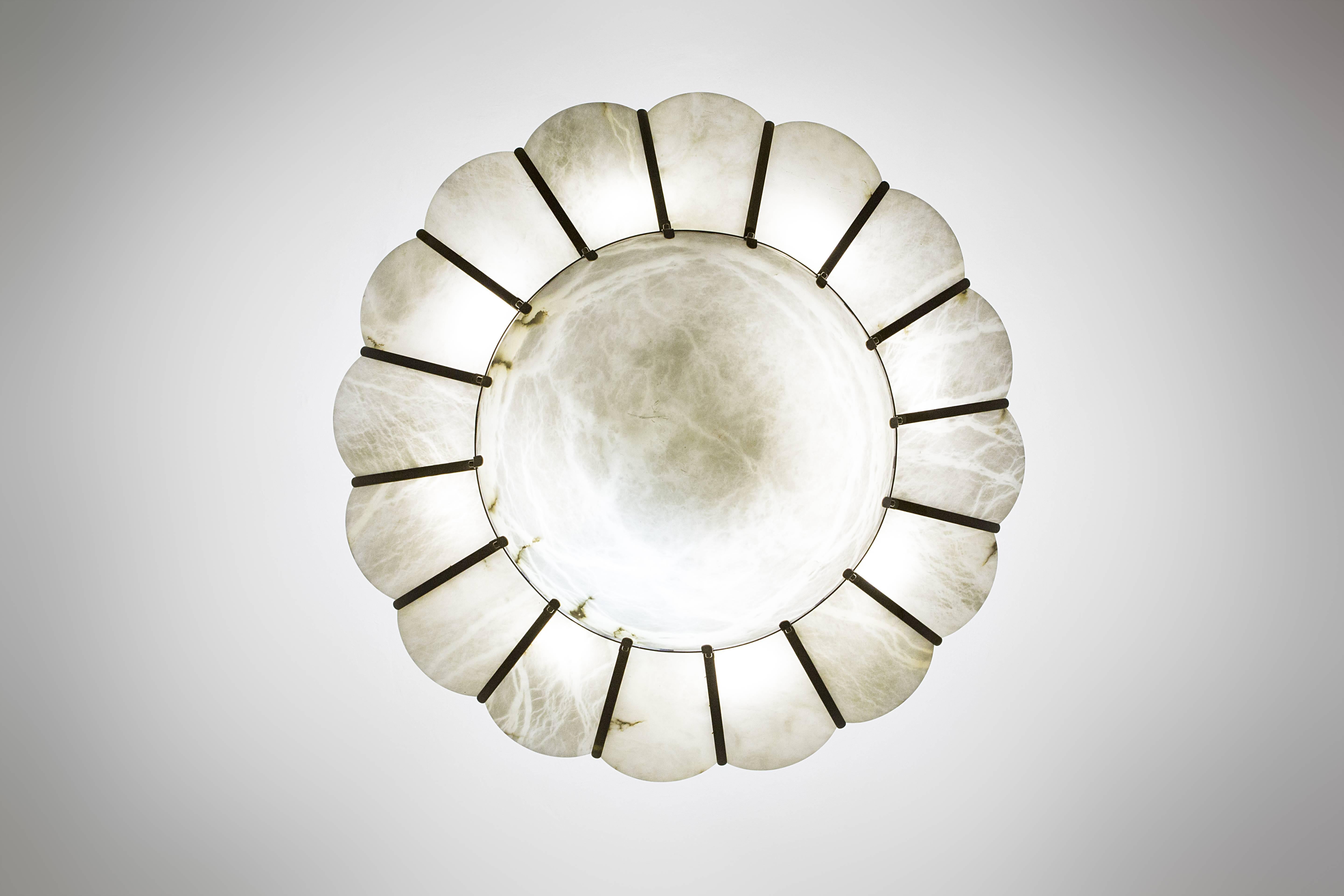 Luster, 
burnished brass and alabaster, 
circa 1960, Italy.
Measure: Height 50 cm, diameter 150 cm.