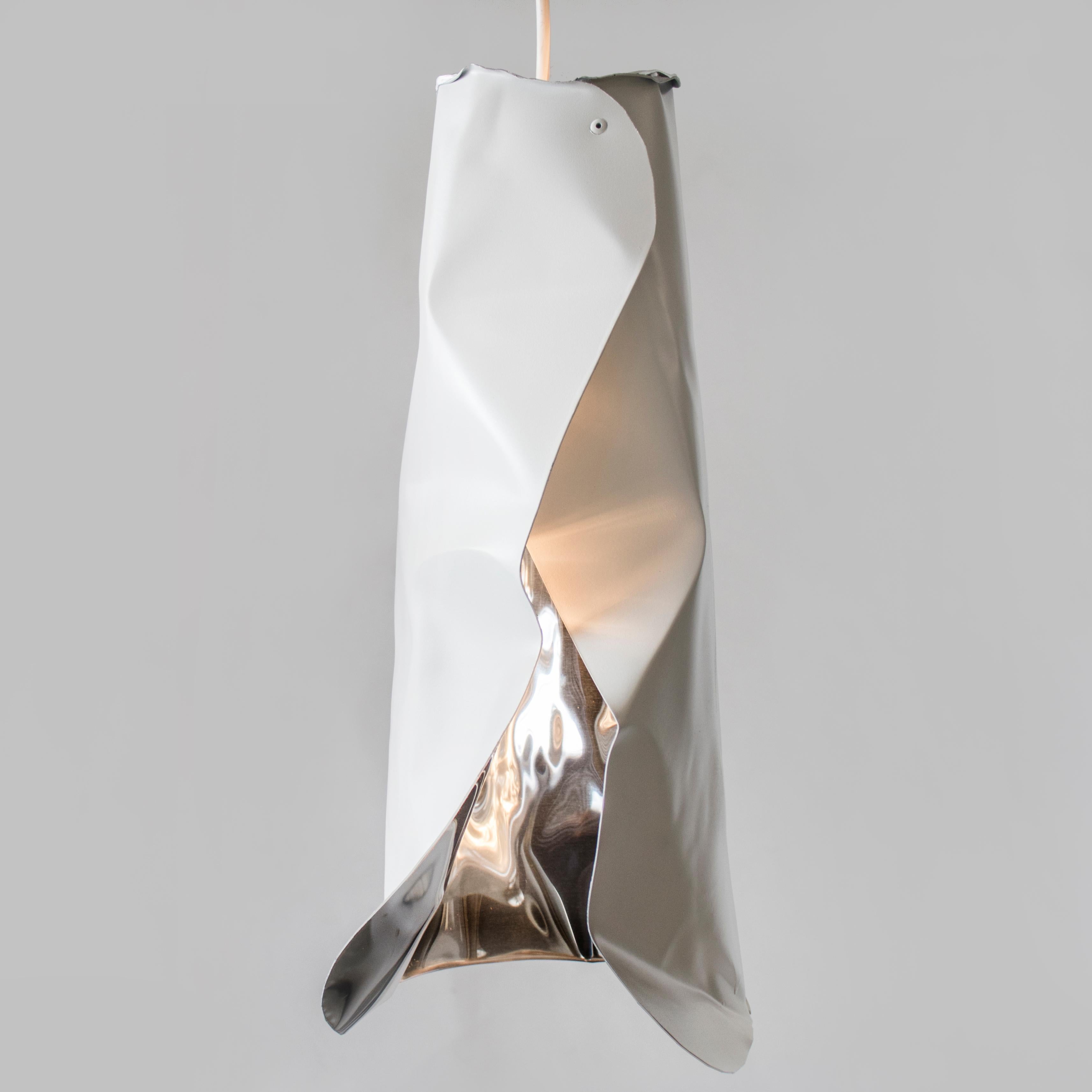 The LUSTER Pendant is handcrafted from polished aluminum. Each piece is individually sculpted by hand, so while similar no two pieces are alike. The effect is a stunning warm glow that works in residential, hospitality and commercial