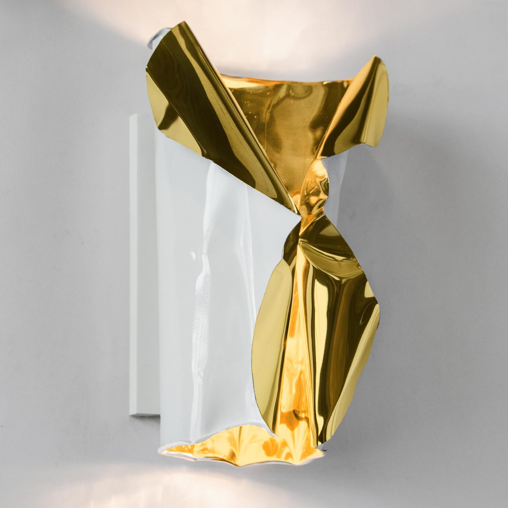 The LUSTER wall sconce is handcrafted from polished gold aluminum. Each piece is individually sculpted by hand so while similar no two pieces are identical. The effect is a stunning warm glow that works in residential, hospitality and commercial