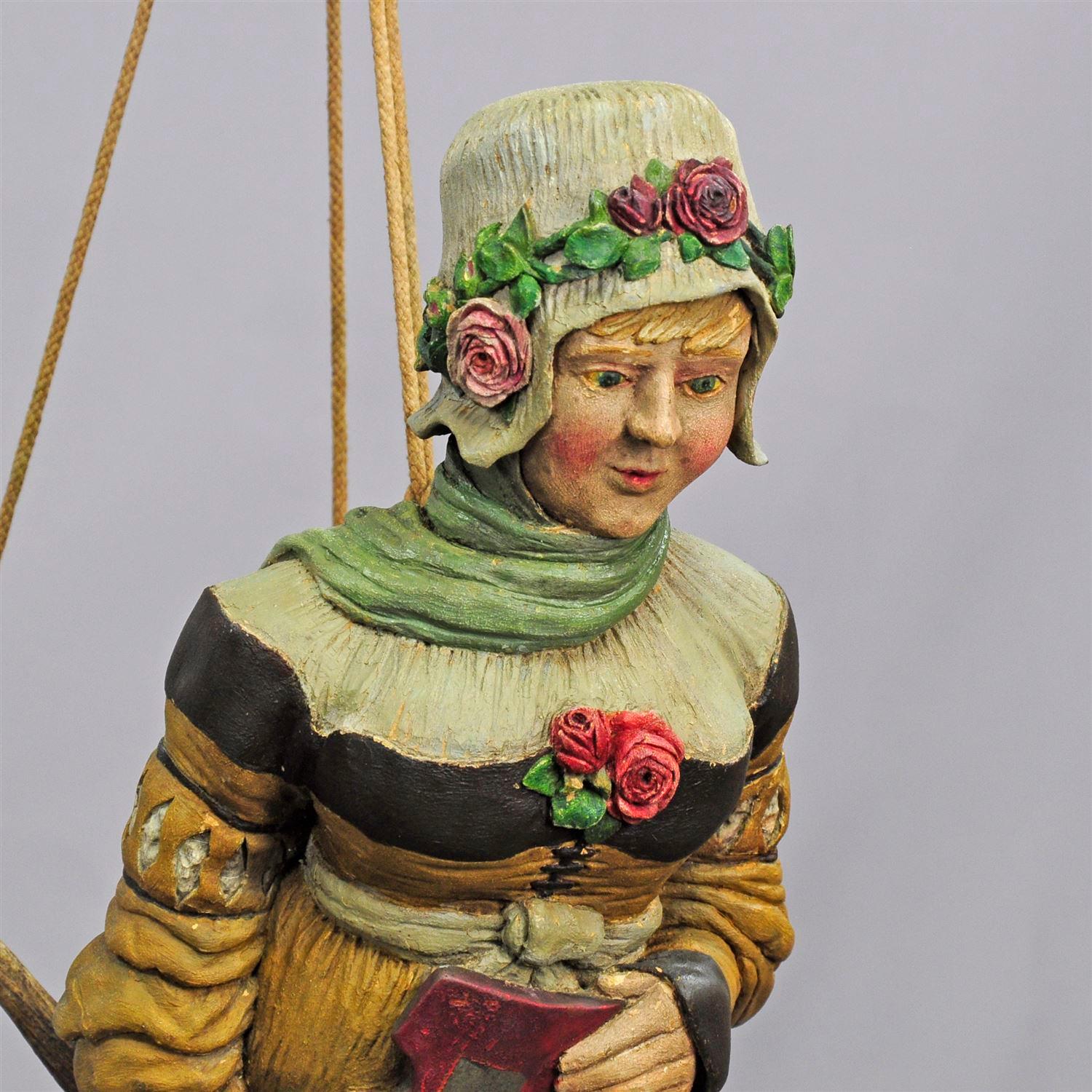 A beautiful lusterweibchen with handsome hand-carved and hand-painted wooden lady carrying a blazon. The lady is wearing a playful head with red roses and the wooden body of the sculpture is fastened to impressive real fallow deer antlers. Executed