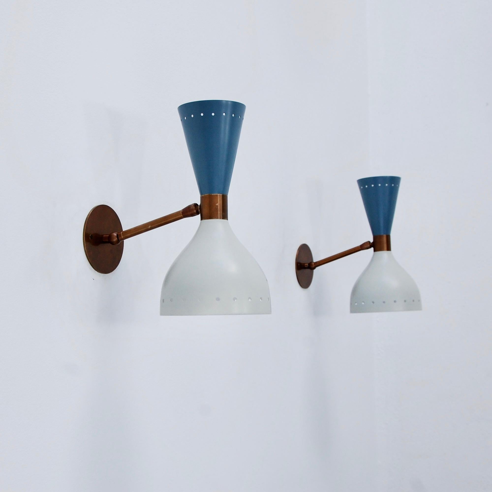 Part of Lumfardo Luminaries contemporary collection, the LUstice Sconce is a companion sconce to our LUstice chandelier. Fabricated in a Classic Mid-Century Modern design, crafted from painted aluminum, and patinated brass. This sconce can be wired