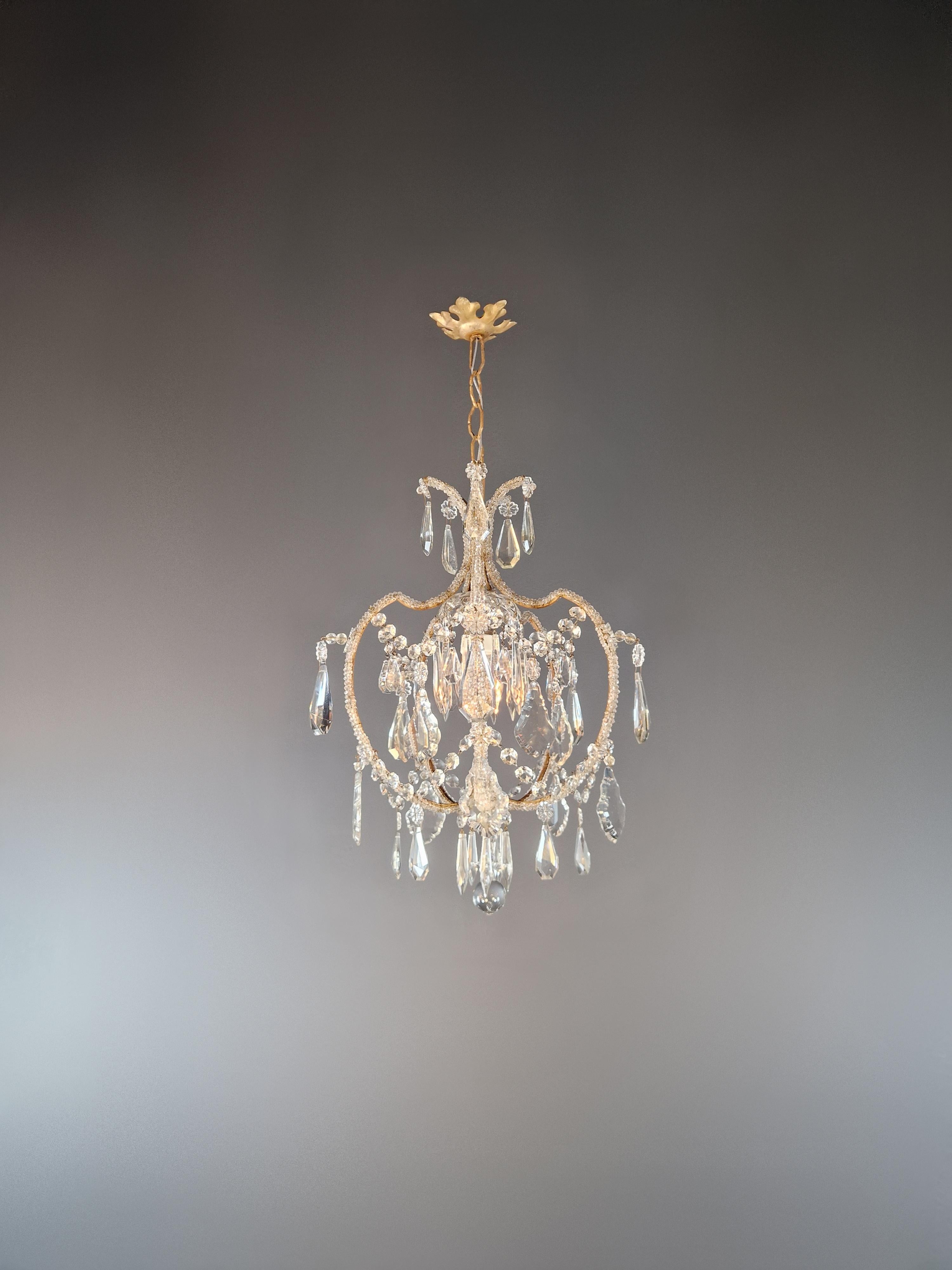 Step back in time with this original 1930 chandelier. It has been carefully restored to embody the timeless elegance of a bygone era while seamlessly incorporating modern improvements. The chandelier's historical integrity has been carefully