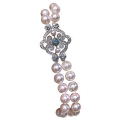 Collana di perle Akoya a doppio filo con chiusura di zaffiri e diamanti