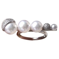 Anello con perle Akoya e diamanti a forma di arco lucido