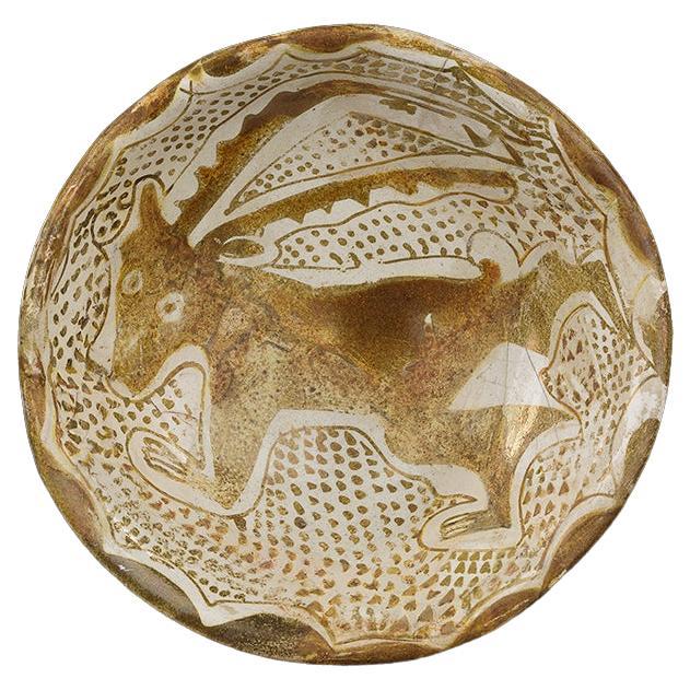 Ancien bol en lustre avec un Ibex