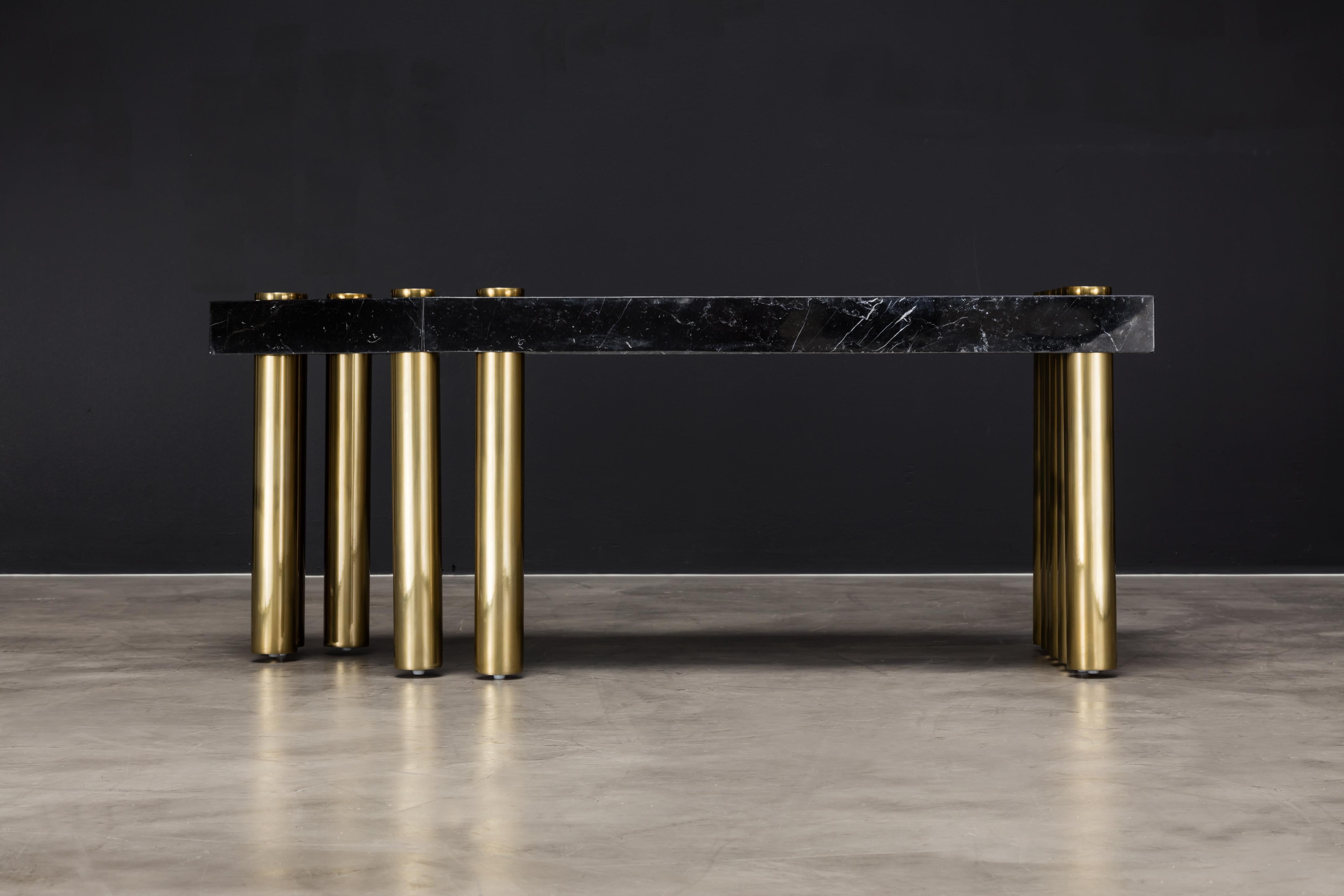 The Lustre coffee table is a modern cocktail table made of powder-coated metal with a Nero Marquina marble top. The asymmetrical and offset bases set this beautiful piece apart from the ordinary. The list price is $8,750; however, this table is in
