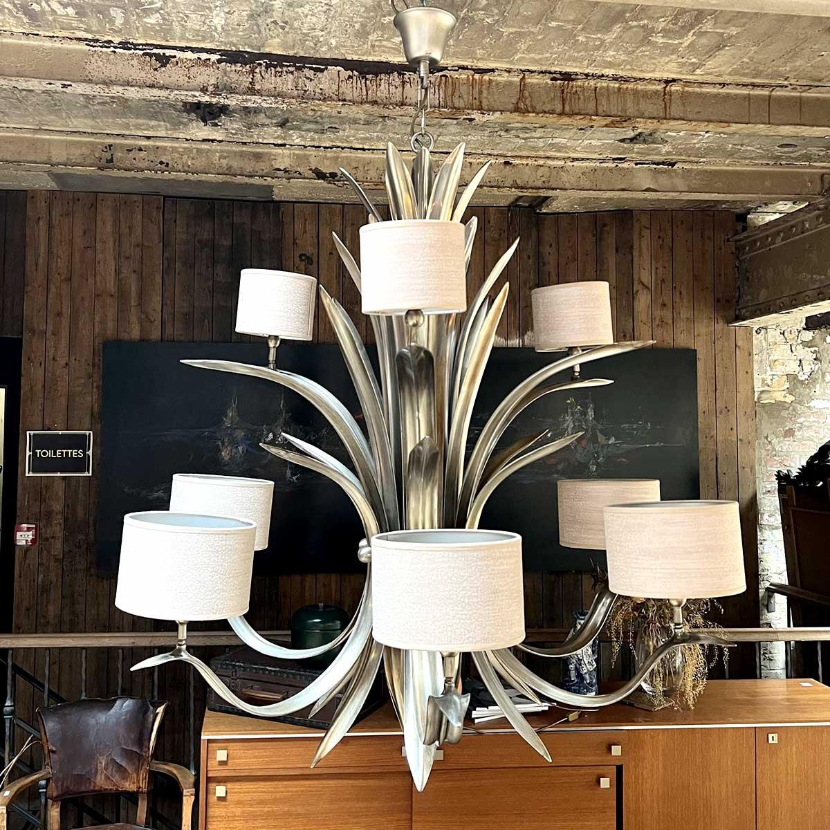 Chandelier in the style of Pieter Adam
Add a touch of contemporary sophistication with this spectacular chandelier inspired by the style of Pieter Adam. Designed in the 2000s, this imposing piece captivates with its sculptural design and silver