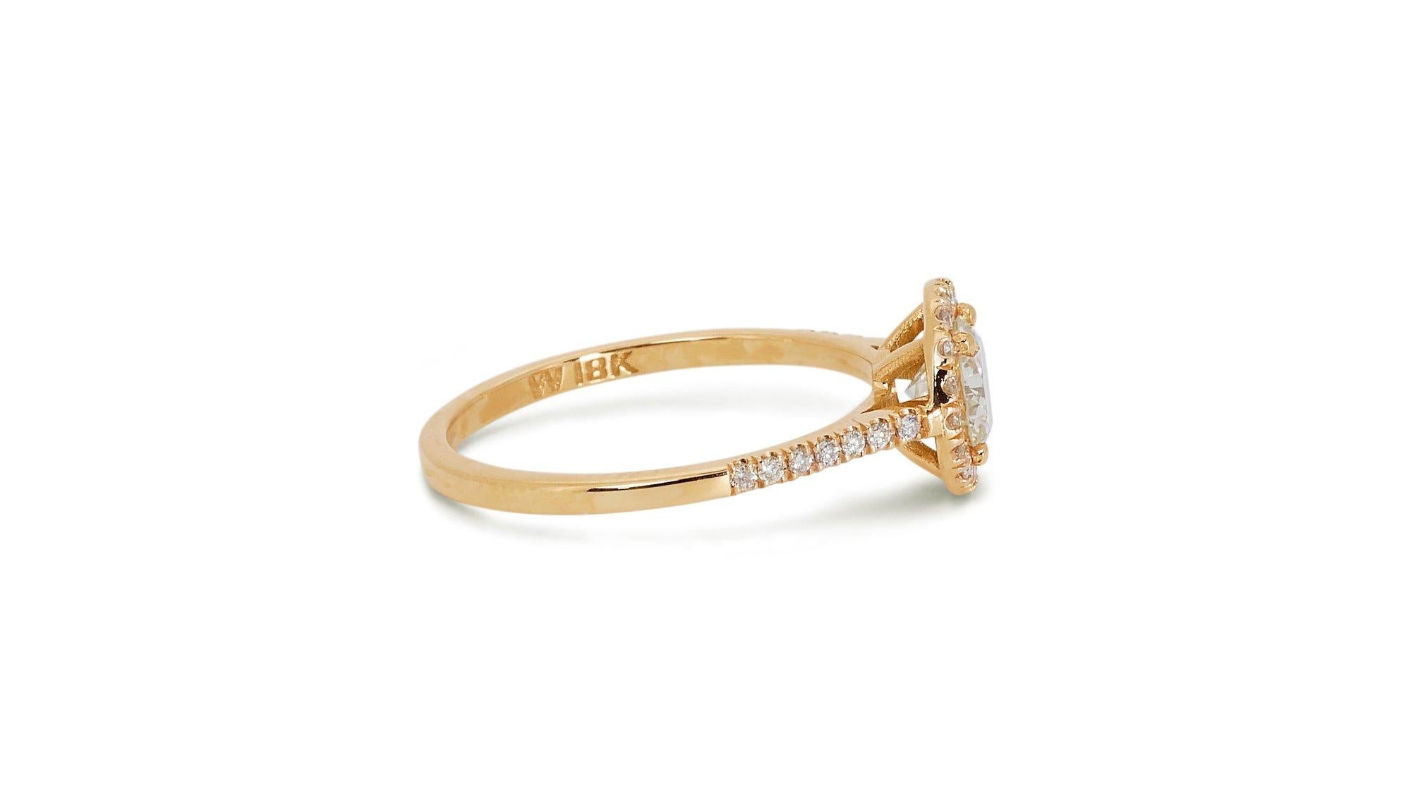 Lustrous 1.11ct Triple Excellent Ideal Cut Diamonds Halo Ring in 18k Yellow Gold - GIA Certified

Elevate your style with this stunning 18k yellow gold halo ring, featuring a radiant 0.90-carat round diamond at its center. This diamond, with a