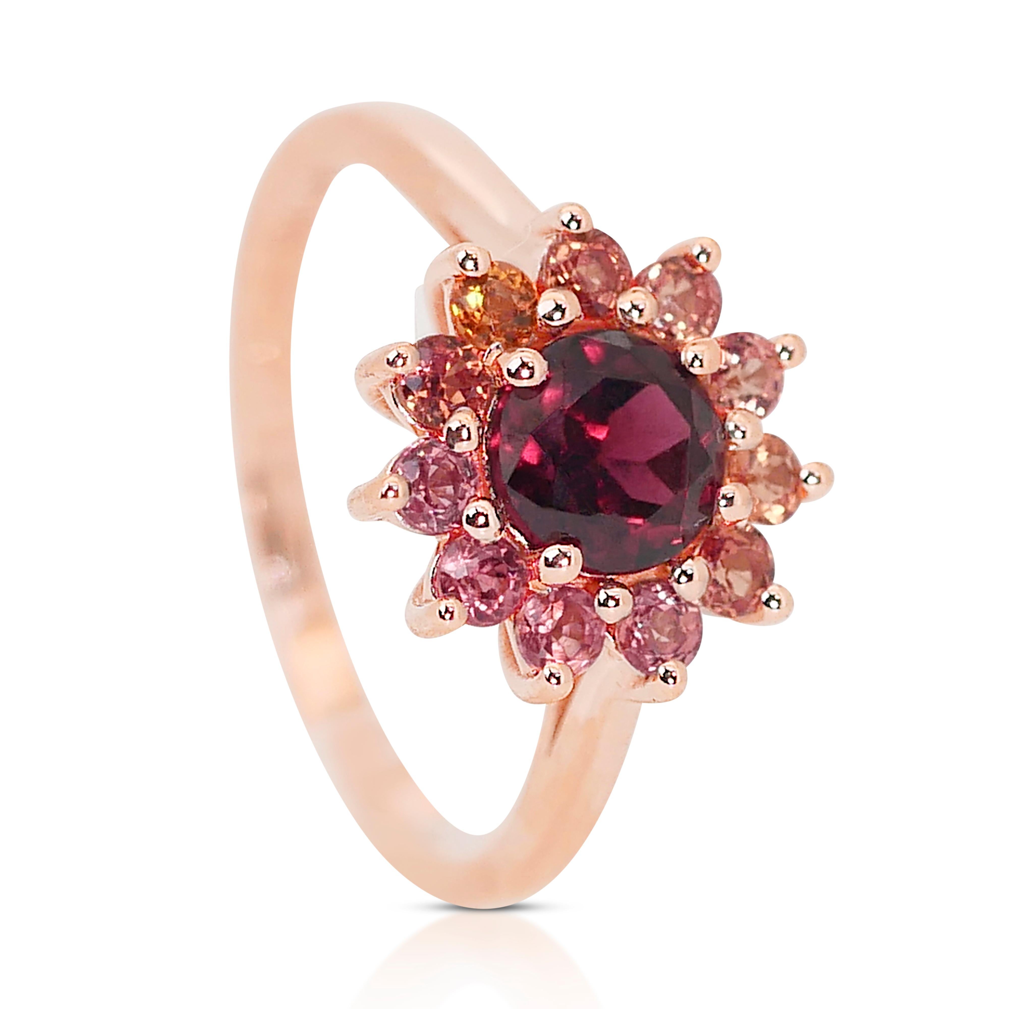 Radiant Passion: 1.20ct Round Garnet Centerpiece with 11 Garnet Side Stones - IGI Certified

A brilliant 1.20-carat round mixed cut garnet halo ring, radiating a rich and transparent red hue that captivates the senses. The main stone, set in