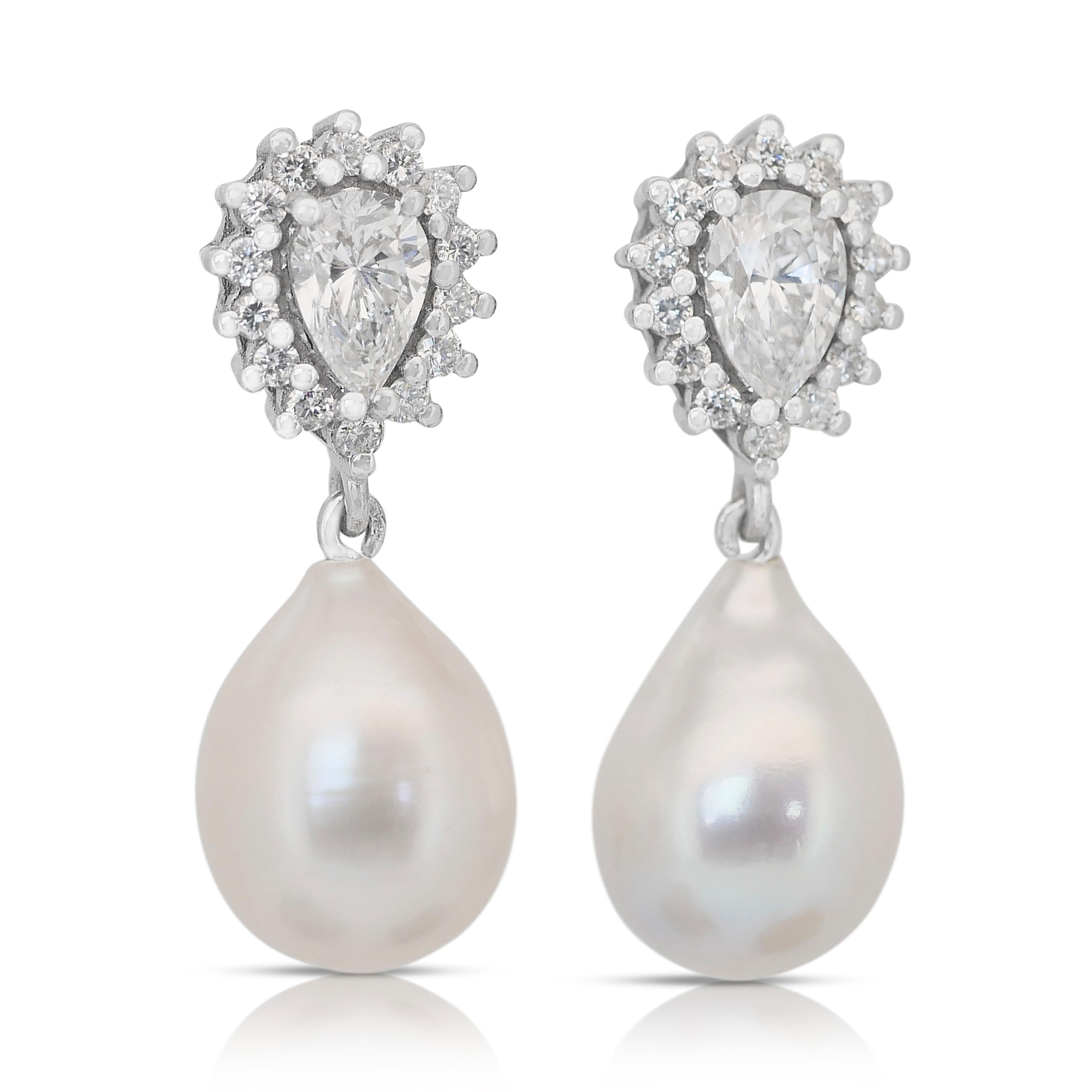 Lustrous and one-of-a-kind 22.07ct Diamonds and Salt, and Cultured Pearls Drop Earrings in 18k White Gold - IGI Certified

A breathtaking blend of brilliance and elegance, these 18k white gold drop earrings feature two pear-cut diamonds with a