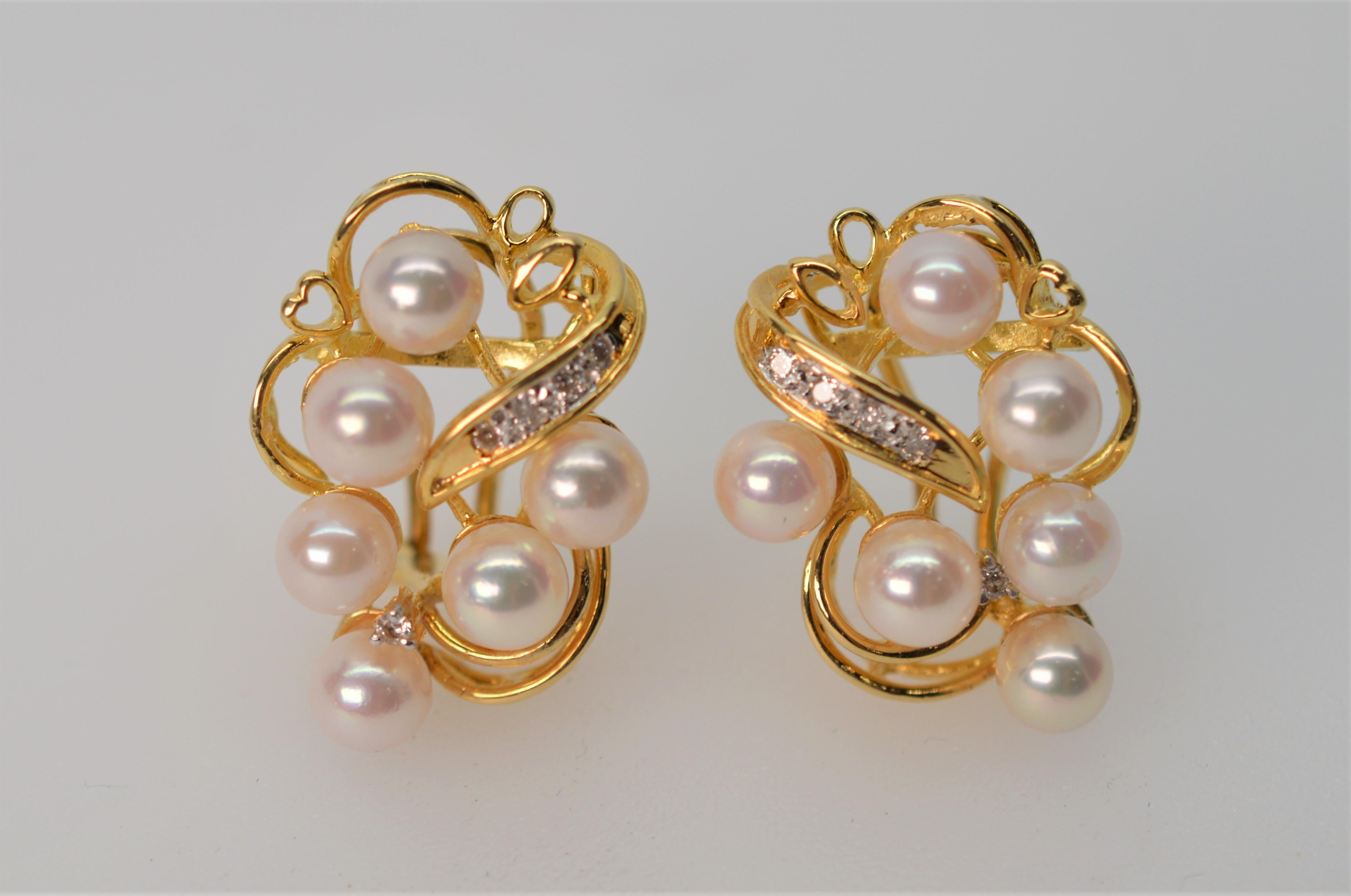 Just the right amount of embelishment adorn this new, never worn pierced earring pair. Each is dressed with six lustrous AAA Akoya Pearls and a 
Pave Diamond flare on an 14K Yellow Gold swirl frame. Measures approximately 1 inch long and 1/2 inch