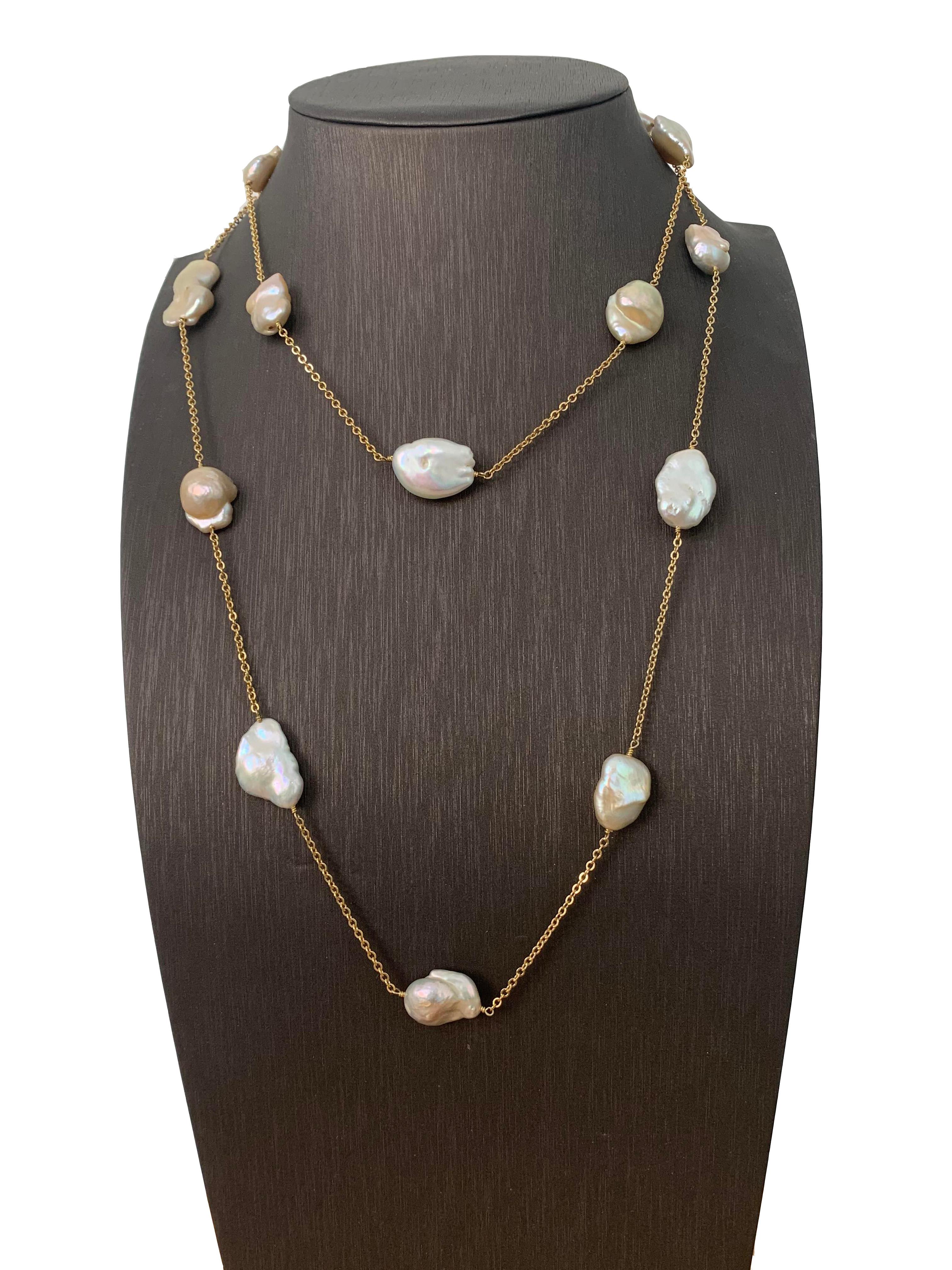 15pc of lustrous white & peach Japanese Keishi Pearl appx 12-17mm on 18k yellow gold plated sterling silver chain 48 Inch Station Necklace. 

Each pearl is unique and has high luster creating beautiful shiny iridescent.  Can be worn long, double, or