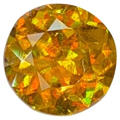 Lustrous Natural Sphene Gemstone: 1.35 Carat MultiColor Round Cut