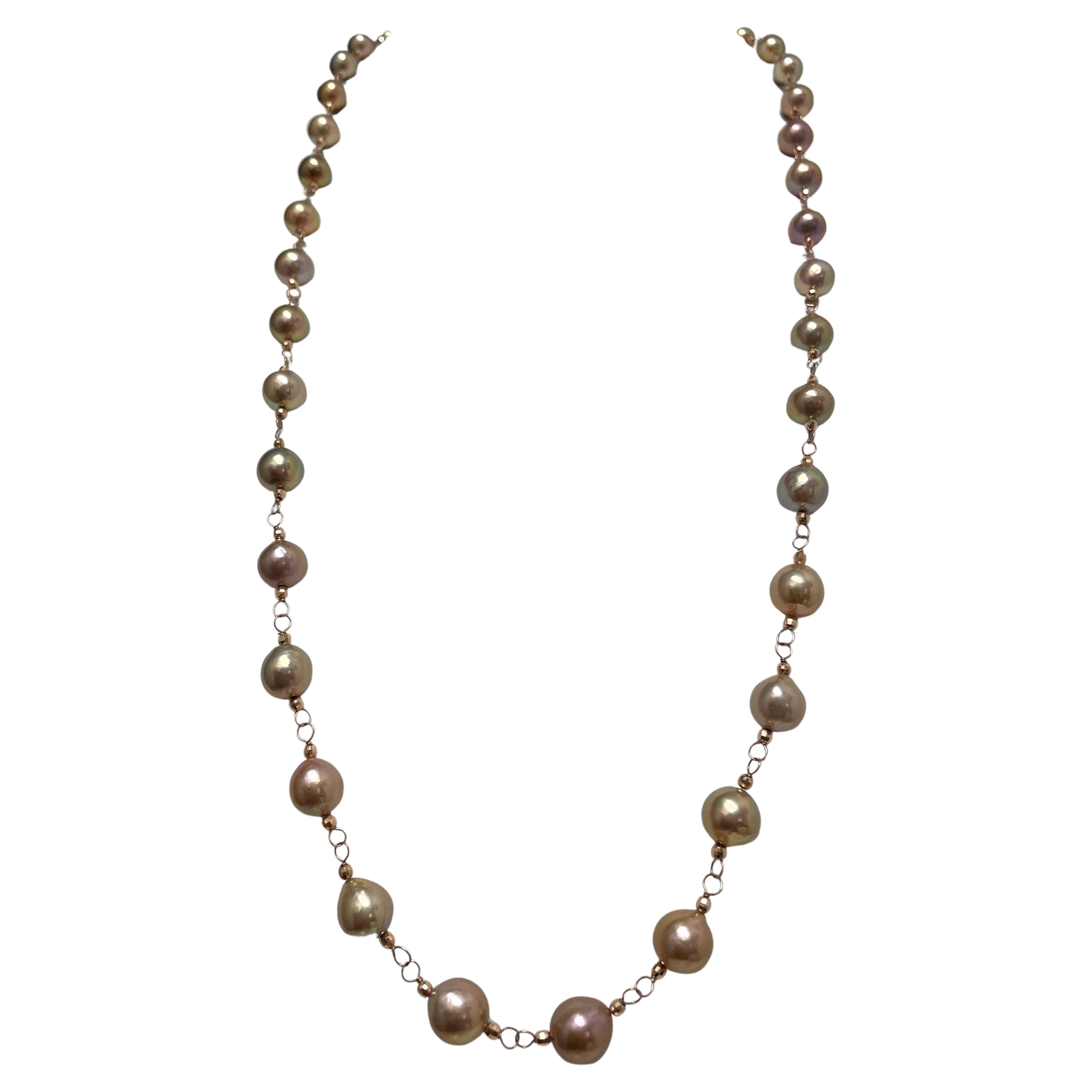 Description
Stunning, highly lustrous, rare tea rose color, round freshwater pearls accented with 14k rose gold faceted balls. Can be worn long or short as a double strand necklace. Item # N3789. 

Materials and Weight
Freshwater nucleated pearls,