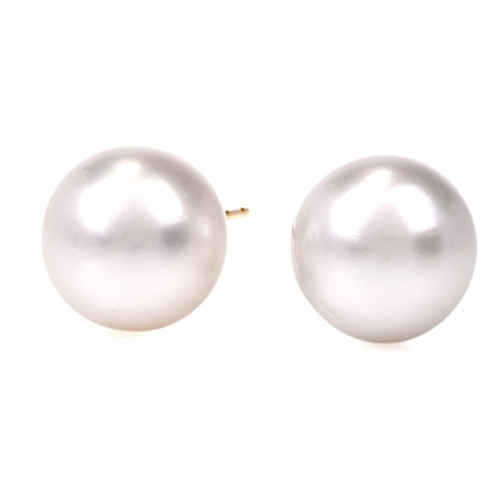 These stylish stud earrings are adorned with 2 genuine Lustrous Pearls approx.: 13mm each, and are crafted in 14K yellow gold. They secure with push backs for pierced ears exclusively and remain in very good condition!

Weight is approx: 6.5 Grams